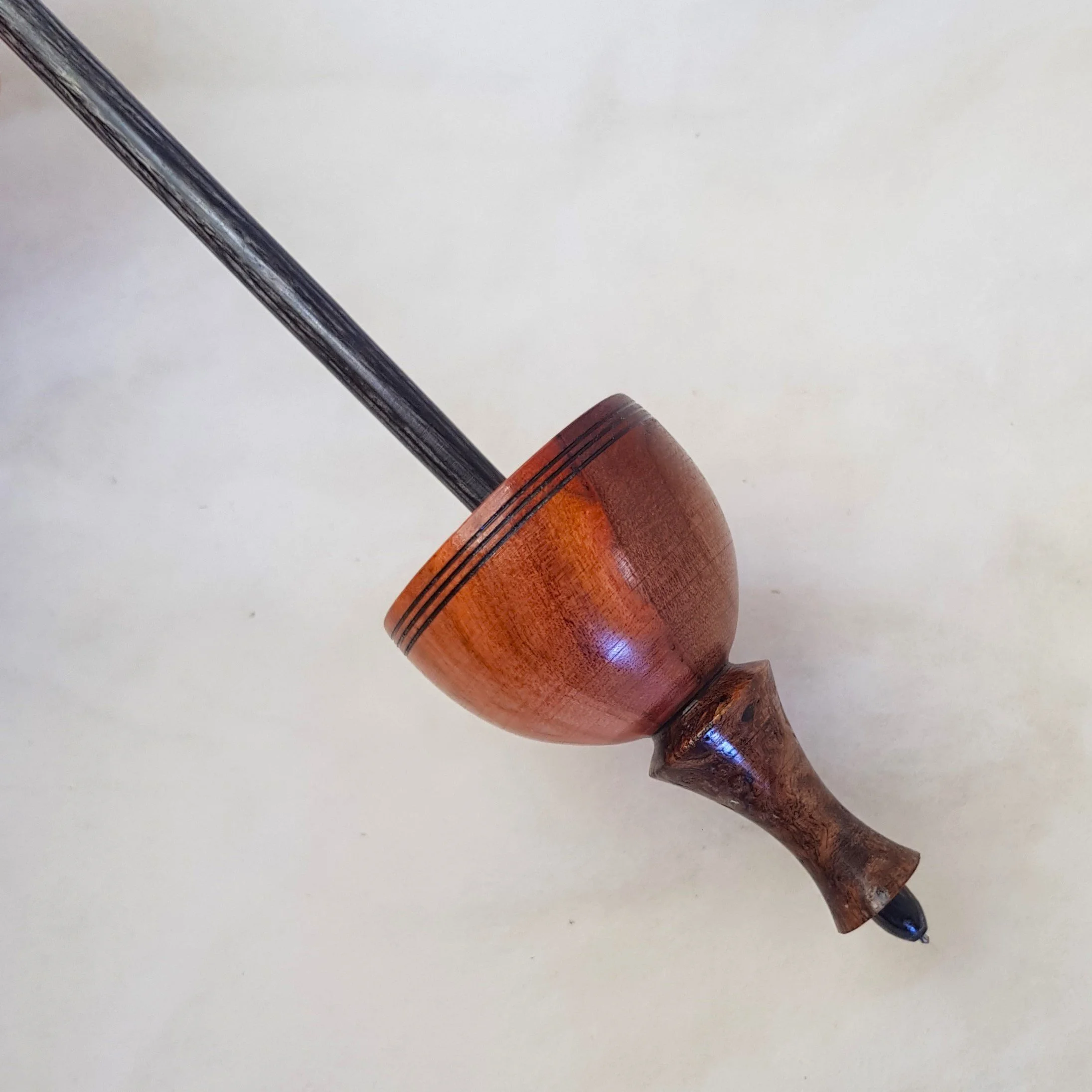 Signature Series - Tibetan - Medium Weight Titanium Tipped Supported Spindle in Highly Figured Brazilian Pepperwood, Highly Figured Ebony Burl, and Frogwood.
