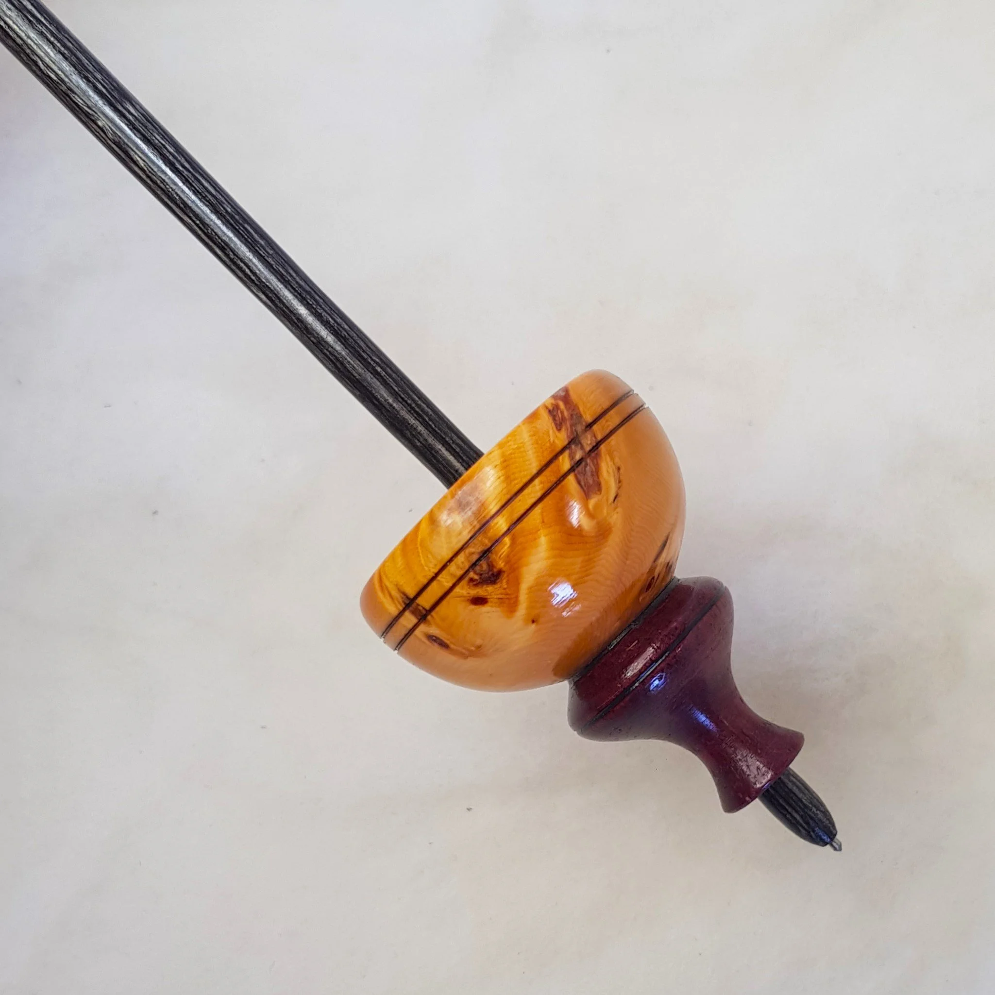 Limited Edition - Tibetan - Medium Weight supported spindle in Highly Figured Birds Eye Huon Pine, Purple Heart, and Frogwood.