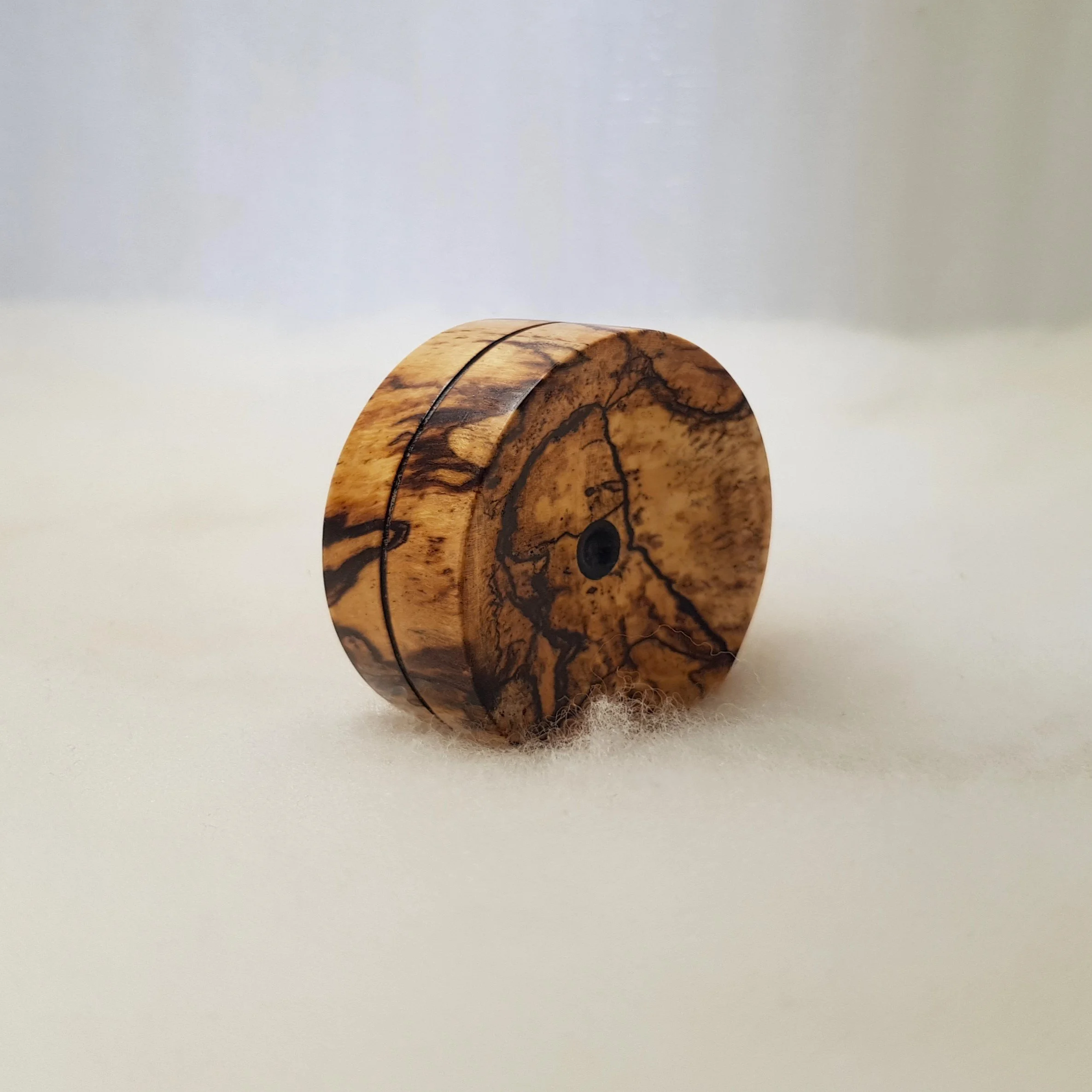 Reversible pocket spinning surface in Spalted and Figured White Eudia and Frogwood Center.
