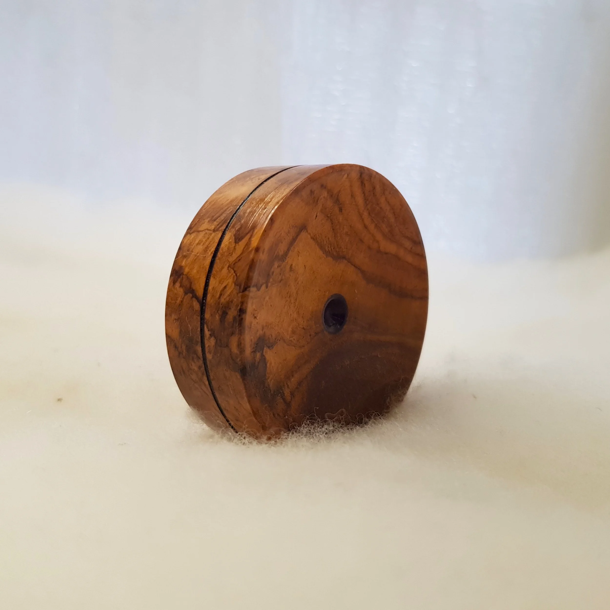 Reversible pocket spinning surface in Very Highly Figured Teak Burl and Frogwood Center.