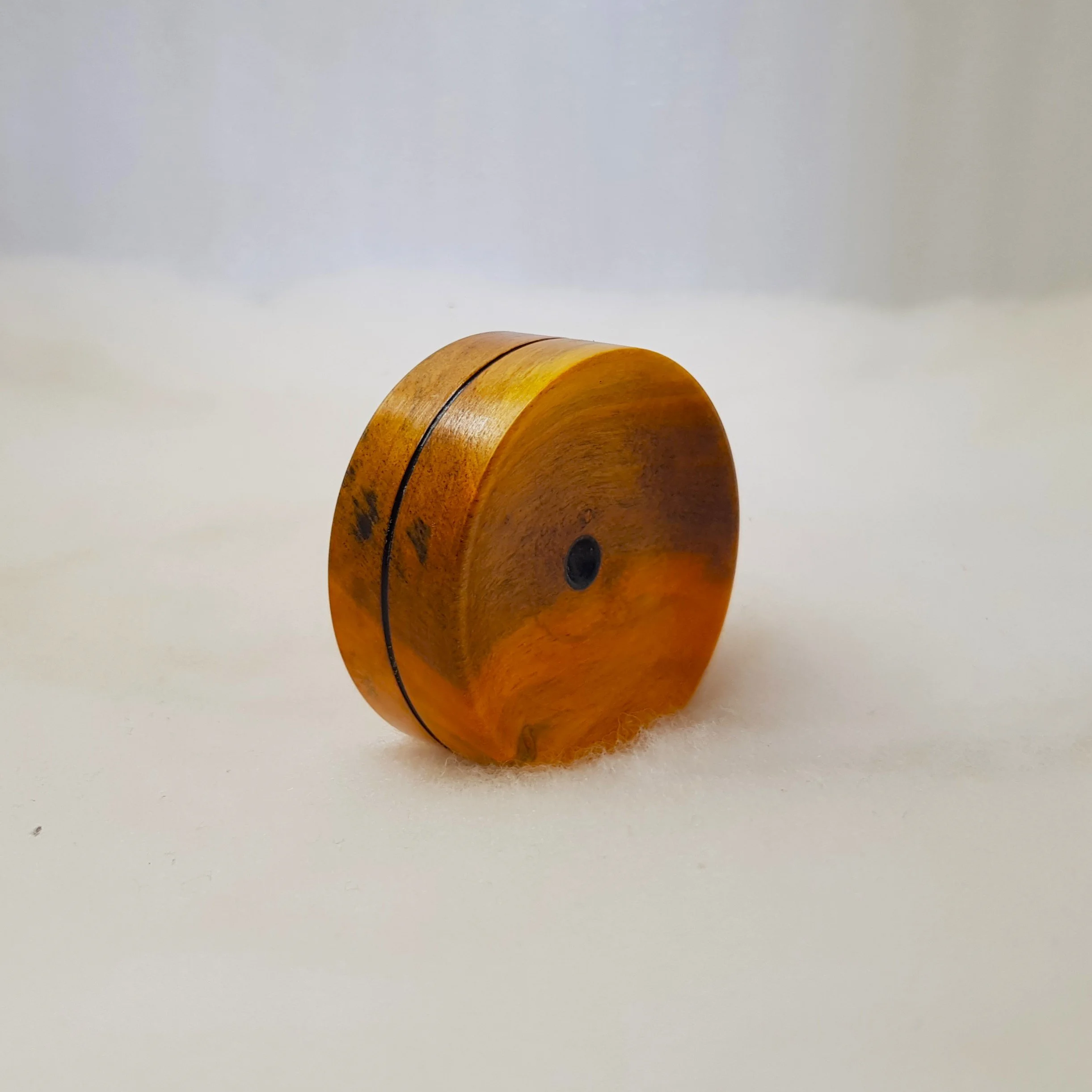 Reversible pocket spinning surface in Highly Figured Leichhardt and Frogwood Center.