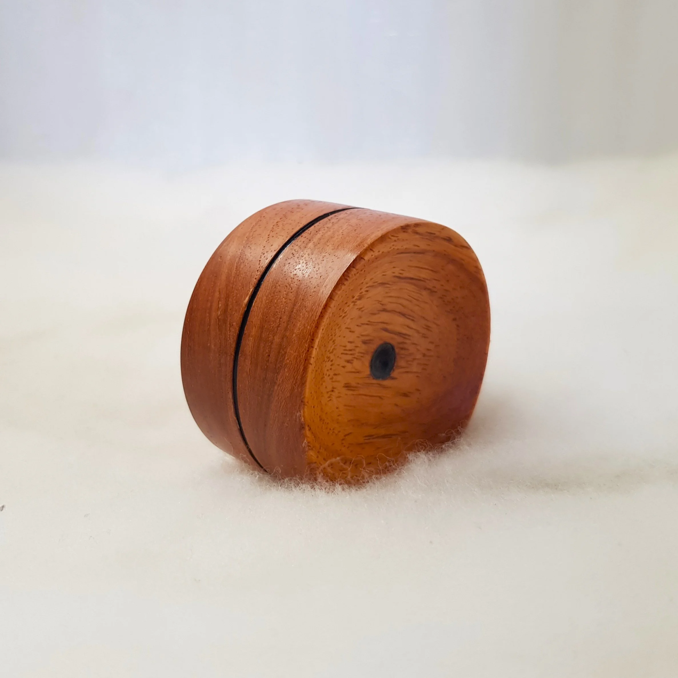 Reversible pocket spinning surface in Very Highly Figured PNG Rosewood and Frogwood Center.