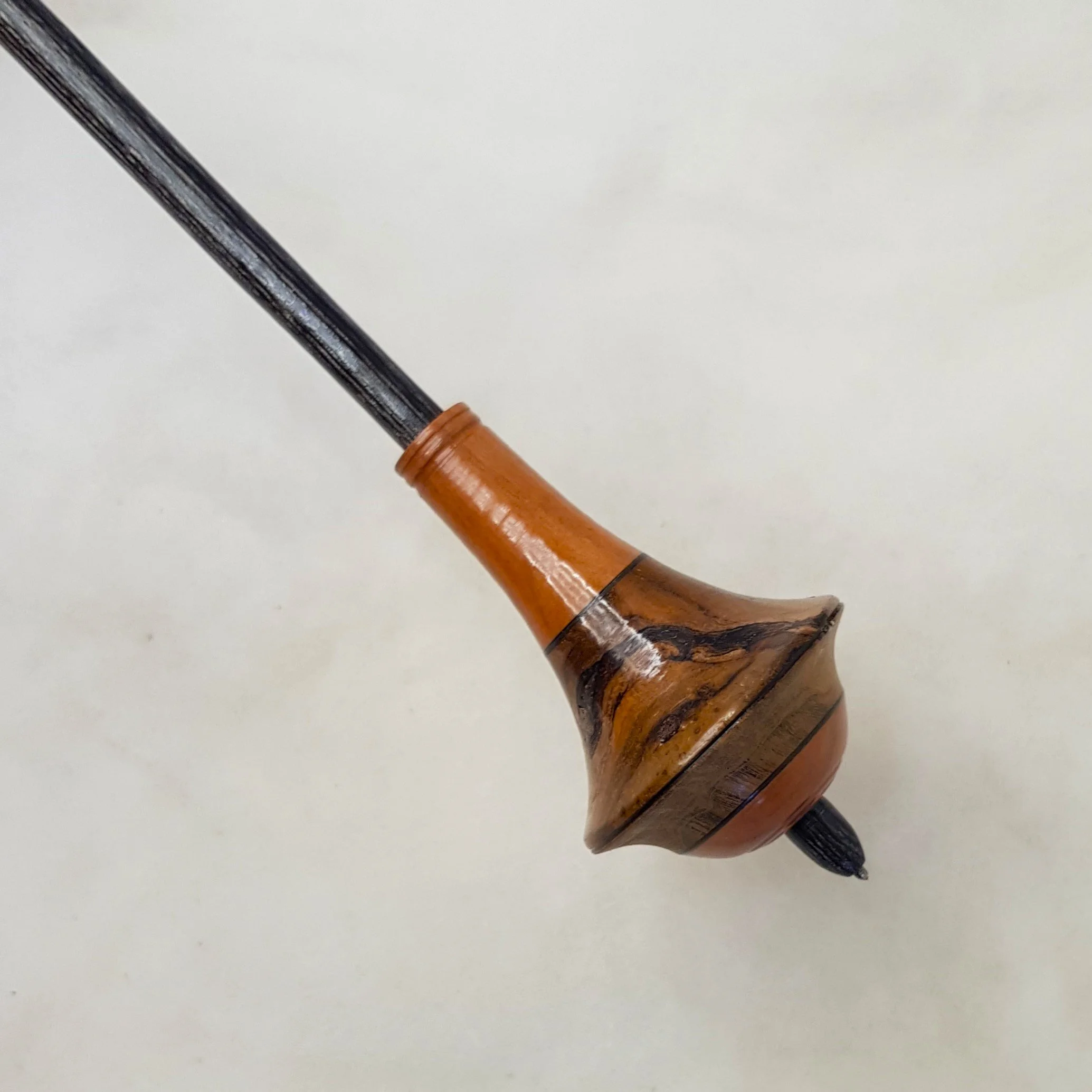 "Jezal" - Limited Edition - Dyavol - Medium Light Weight, Titanium tipped supported spindle in Teak Burl, Figured Budgeroo, and Frogwood.