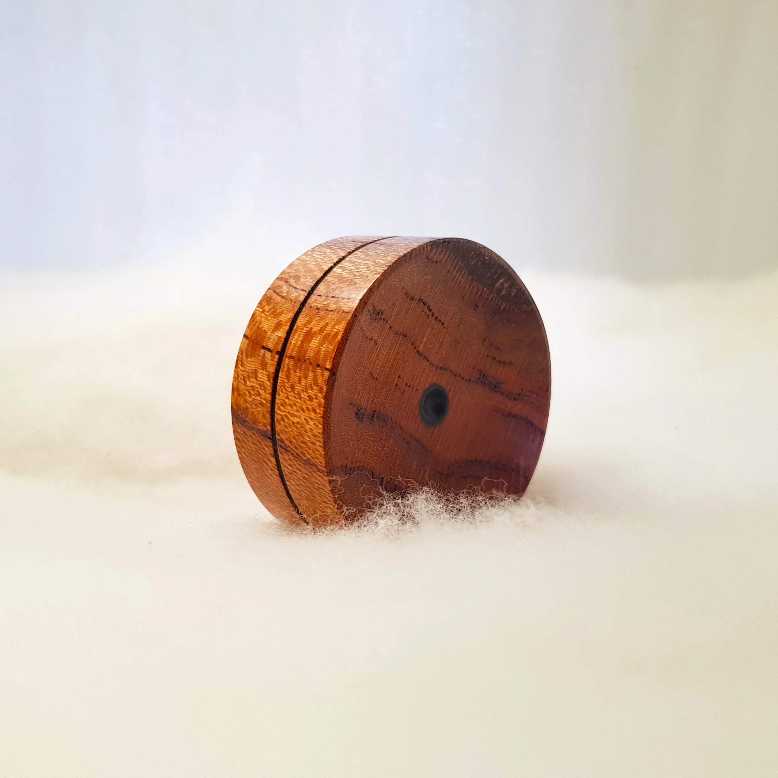Reversible pocket spinning surface in Very Highly Figured Silky Oak and Frogwood Center.