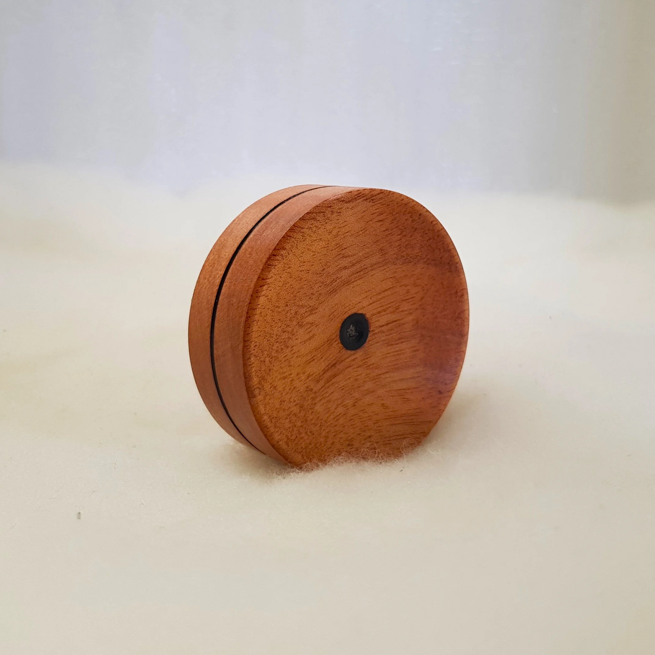 Reversible pocket spinning surface in Highly Figured Queensland Maple and Frogwood Center.