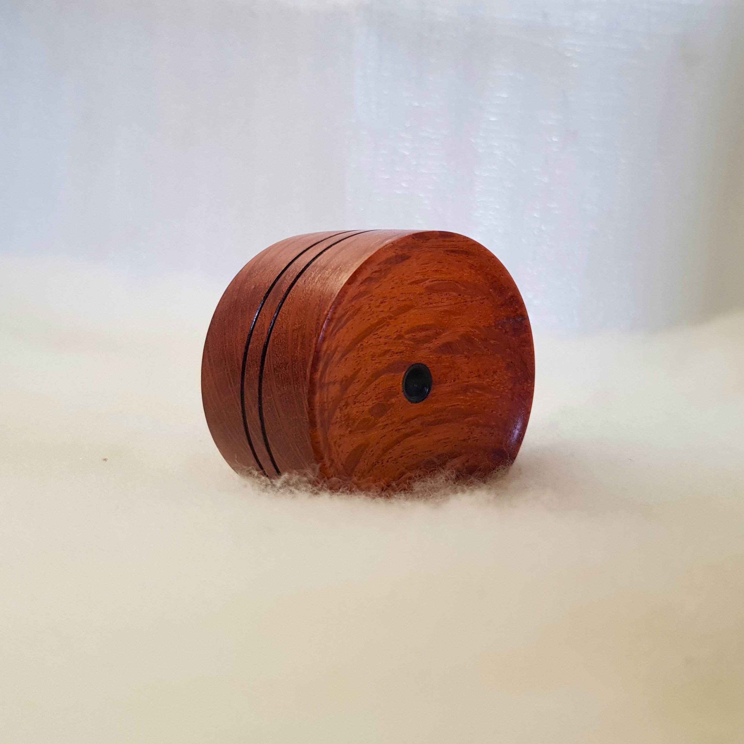 Reversible pocket spinning surface in Highly Figured Flame Oak and Frogwood Center.