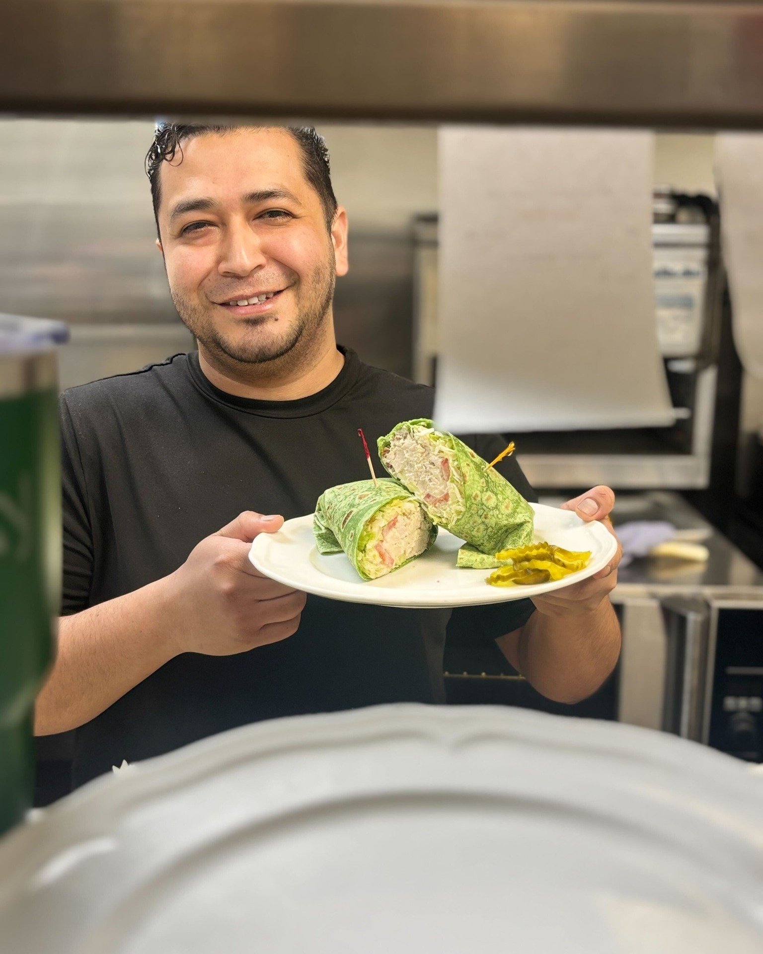 Start out your week right &amp; dine in with us until 2:00pm today (last seating at 1:45pm)! Buddy, who makes all of our signatures sandwiches &amp; wraps, is delighted to serve you 🥪

Dining in with us or ordering carryout continues our mission of 