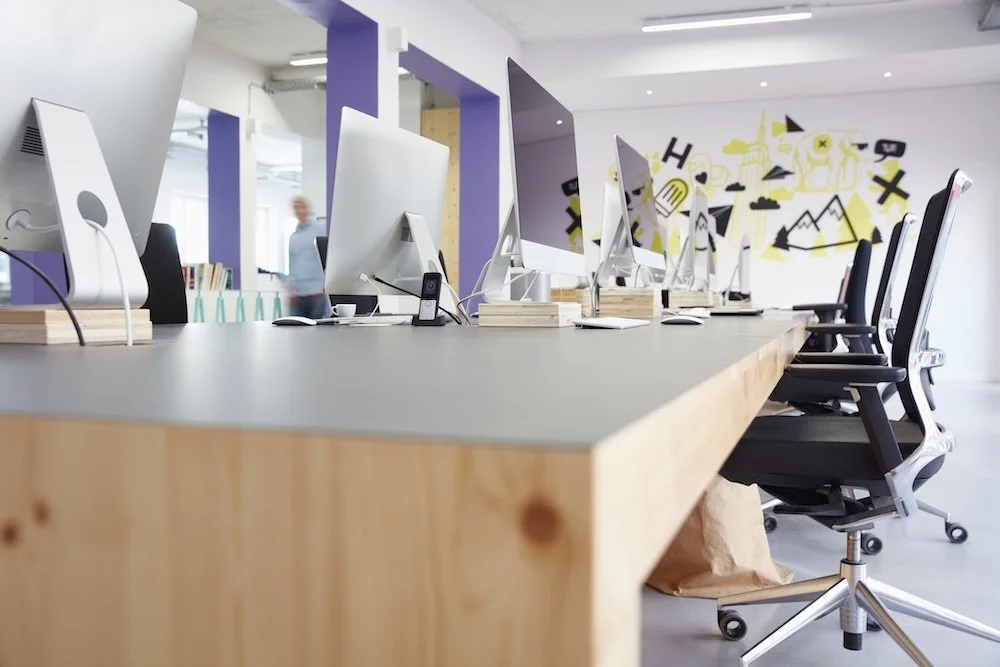 Modern office space for your business featuring open workstations, ergonomic seating, and a bright collaborative environment