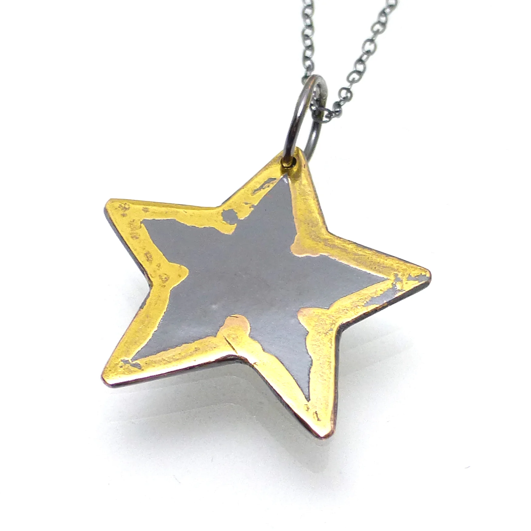 Star necklace with 22kt gold dots