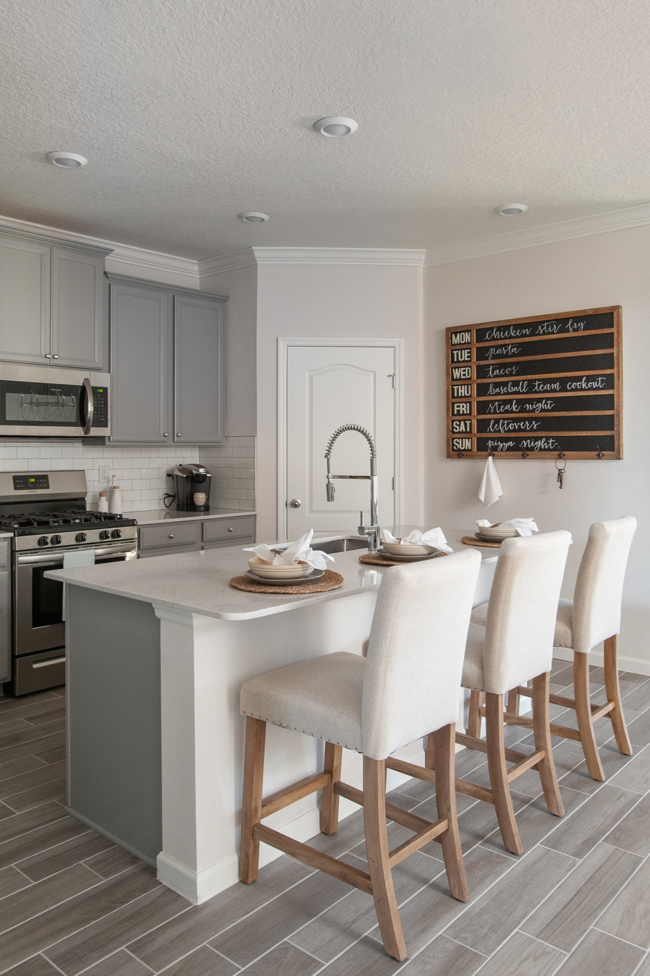 Micamy_Interior Designer_Design_Interior_Model_Merchandising_Kitchen_Grey_Cabinets_Forty West_Lennar_Place Setting_SubwayTile_Farmhouse_Faucet.jpg