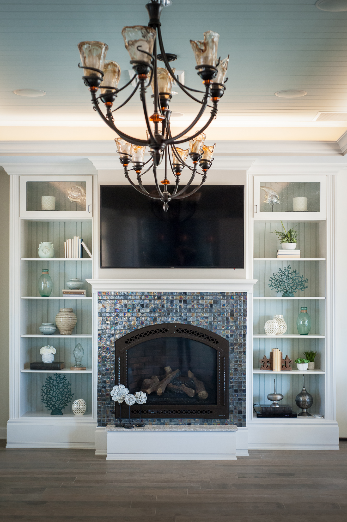 Micamy_Design_Studio_Interior_Design_Artisan_Lakes_Clubhouse_Serene_Coastal_Glass_Mosaic_Tile_Backsplash_Fireplace_SherwinWilliams_Crossville_Blue_ (2).jpg