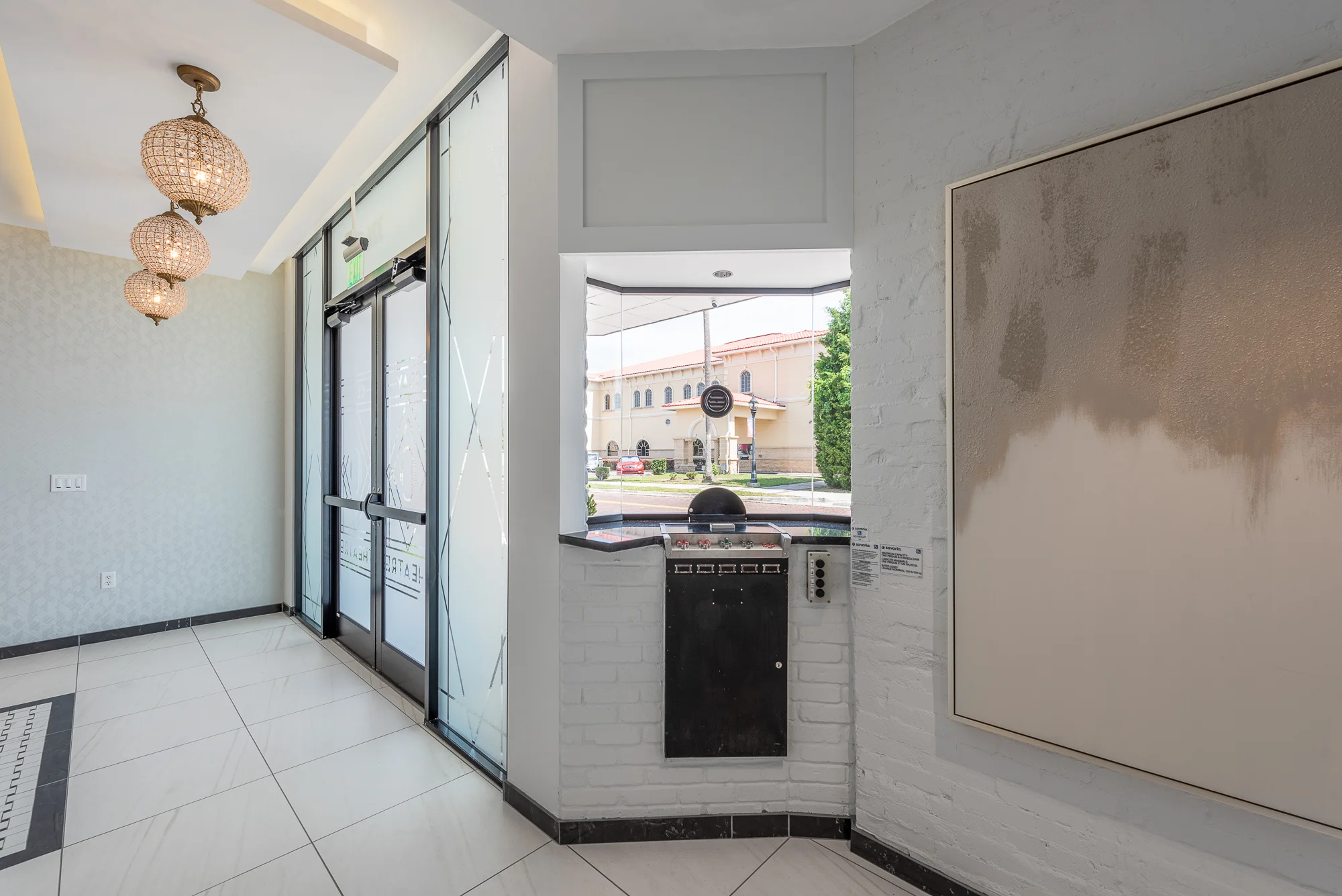 Micamy Design Studio_Interior Design_Clay Theatre_Event Space_Venue_Art Deco_Modern_Floating Shelf_Entry_Ticket Booth_Marble Floors_Ticket Window.jpg
