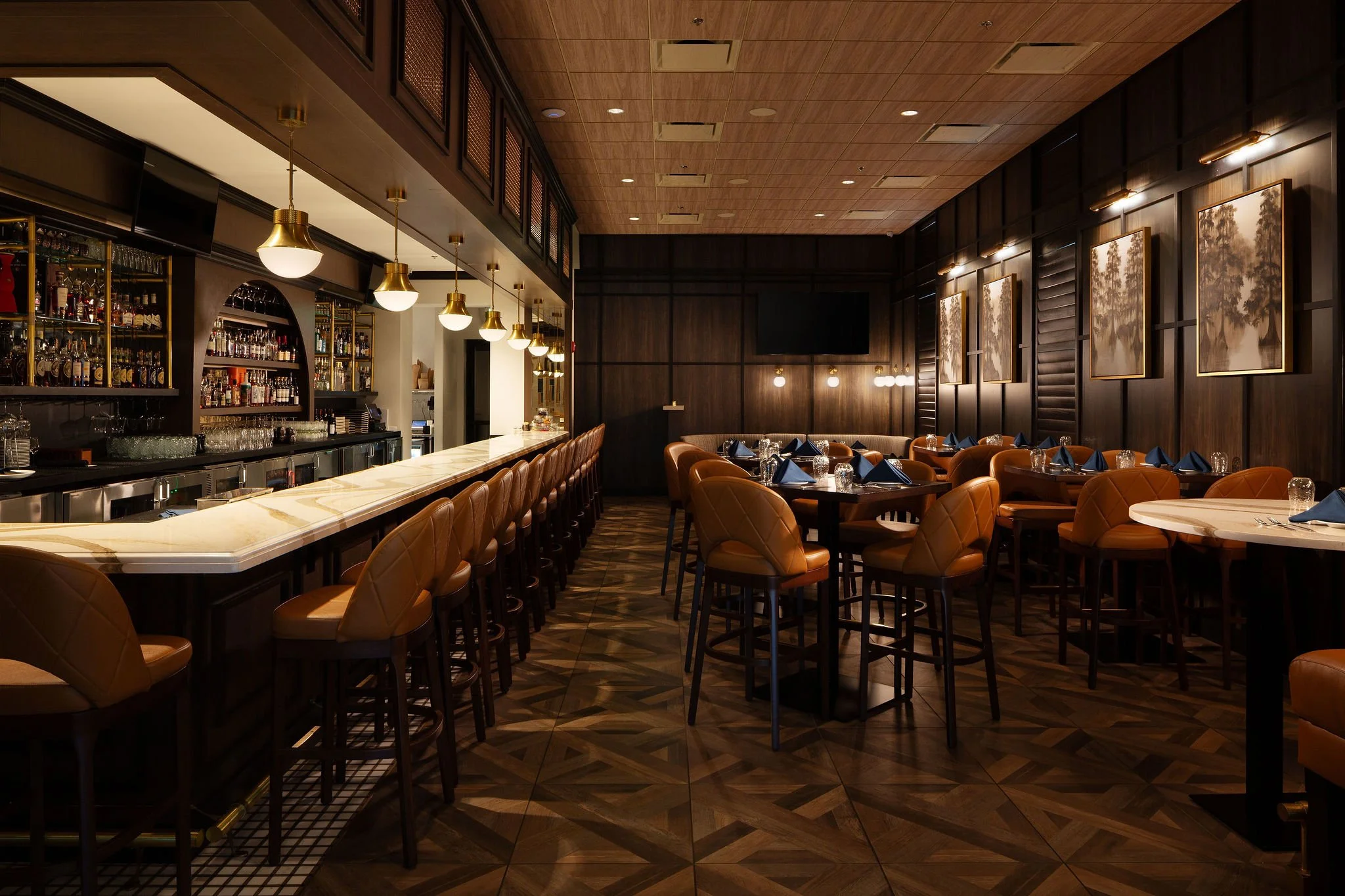 Micamy Design Studio_Chophouse_Nocatee_Restaurant Bar_Quartz Counter_Brass Pendants_Dark Wood Panel Wall_Parquet Wood Tile_Bar Shelving.jpg