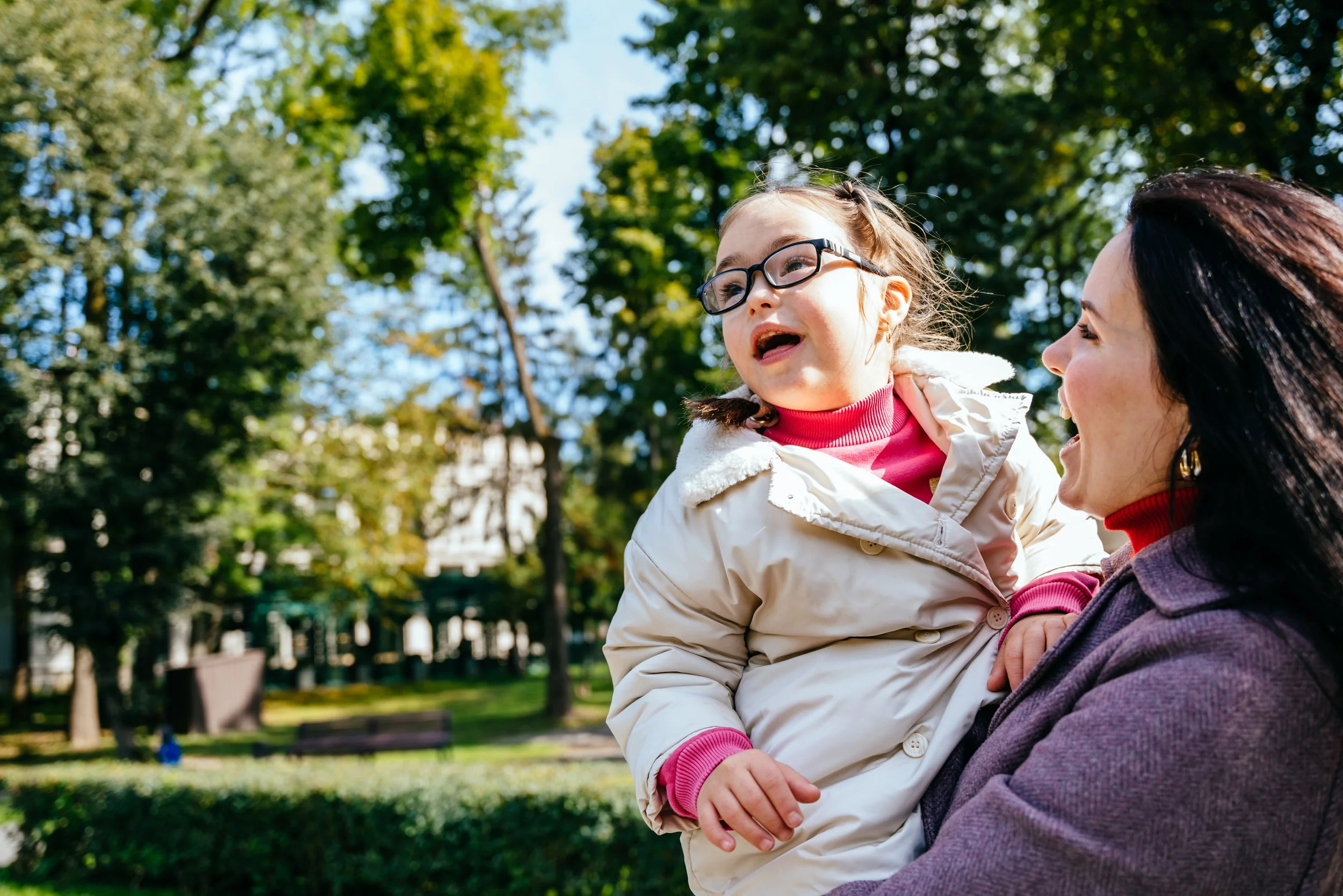 A girl with additional needs in the park.