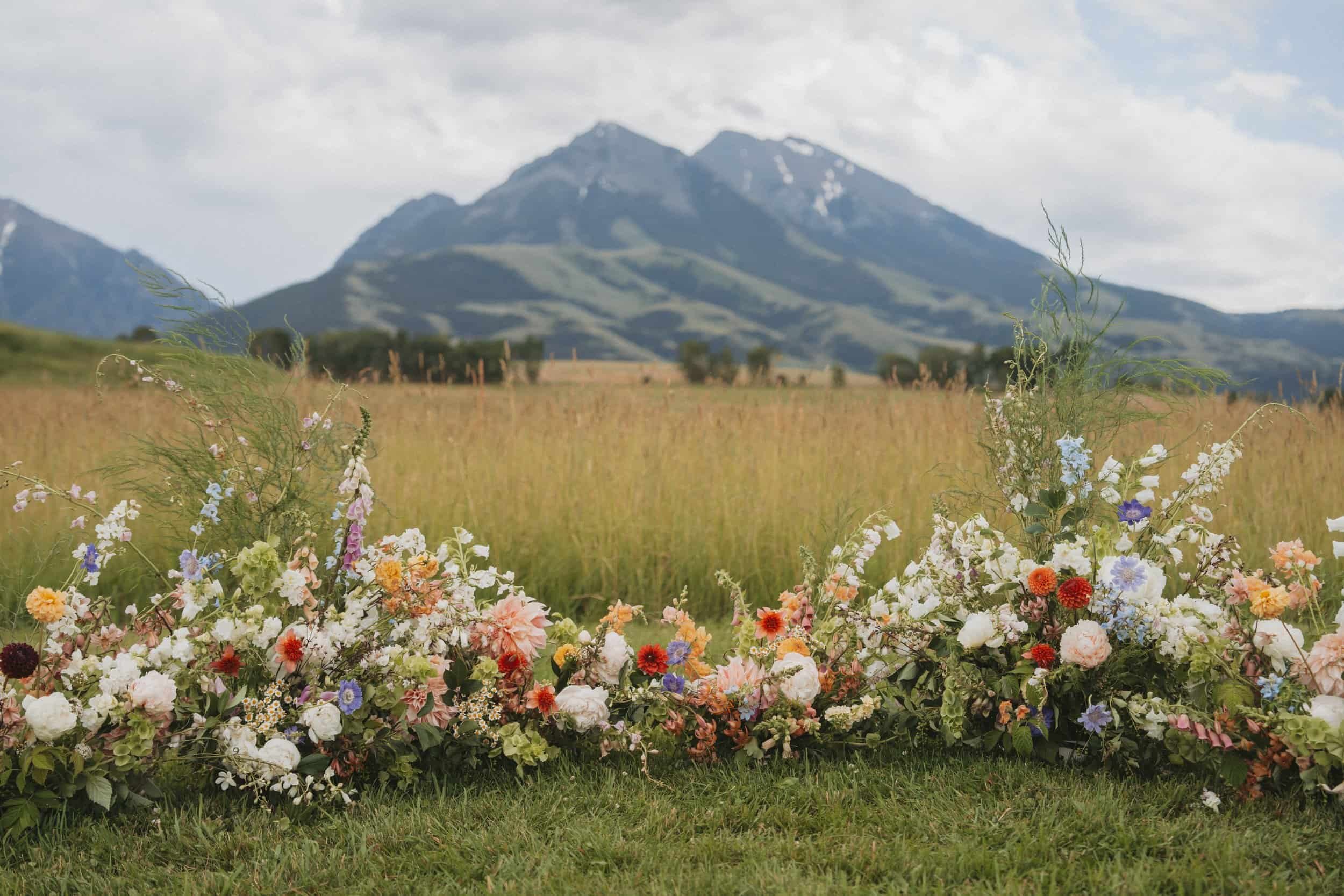 Bozeman montana florist Wedding floral meadow at sage lodge framing emigrant peak and other mountains