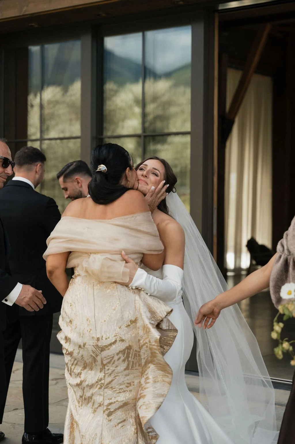 bride hugging the groom's mother