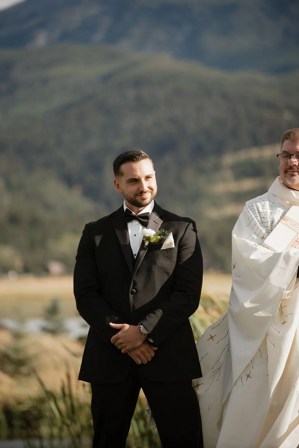 the groom looking at the bride as she walks down the aisle