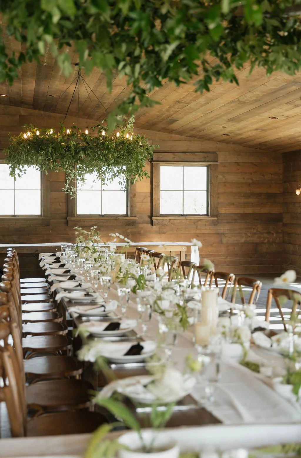 greenery on the chandeliers above the tables at copper rose ranch 