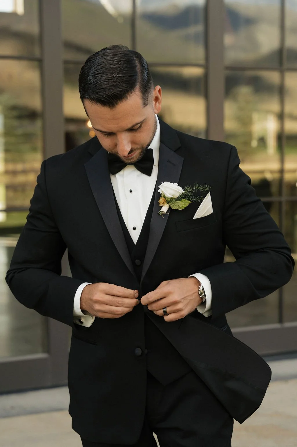 italian groom with white boutonniere and 3 piece tux with classic buttons and watch 