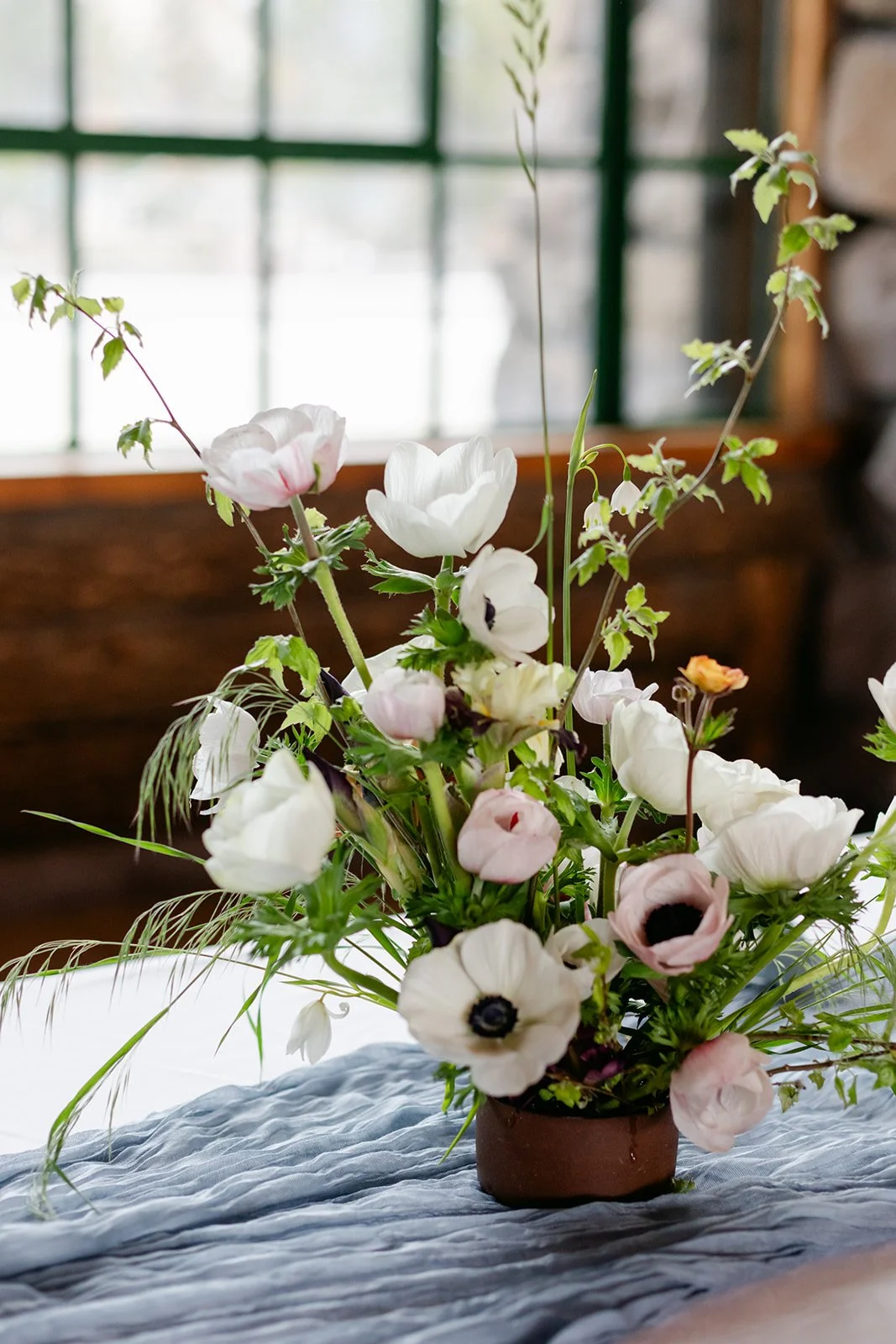 white-anemone-arrangement-on-blue-runner