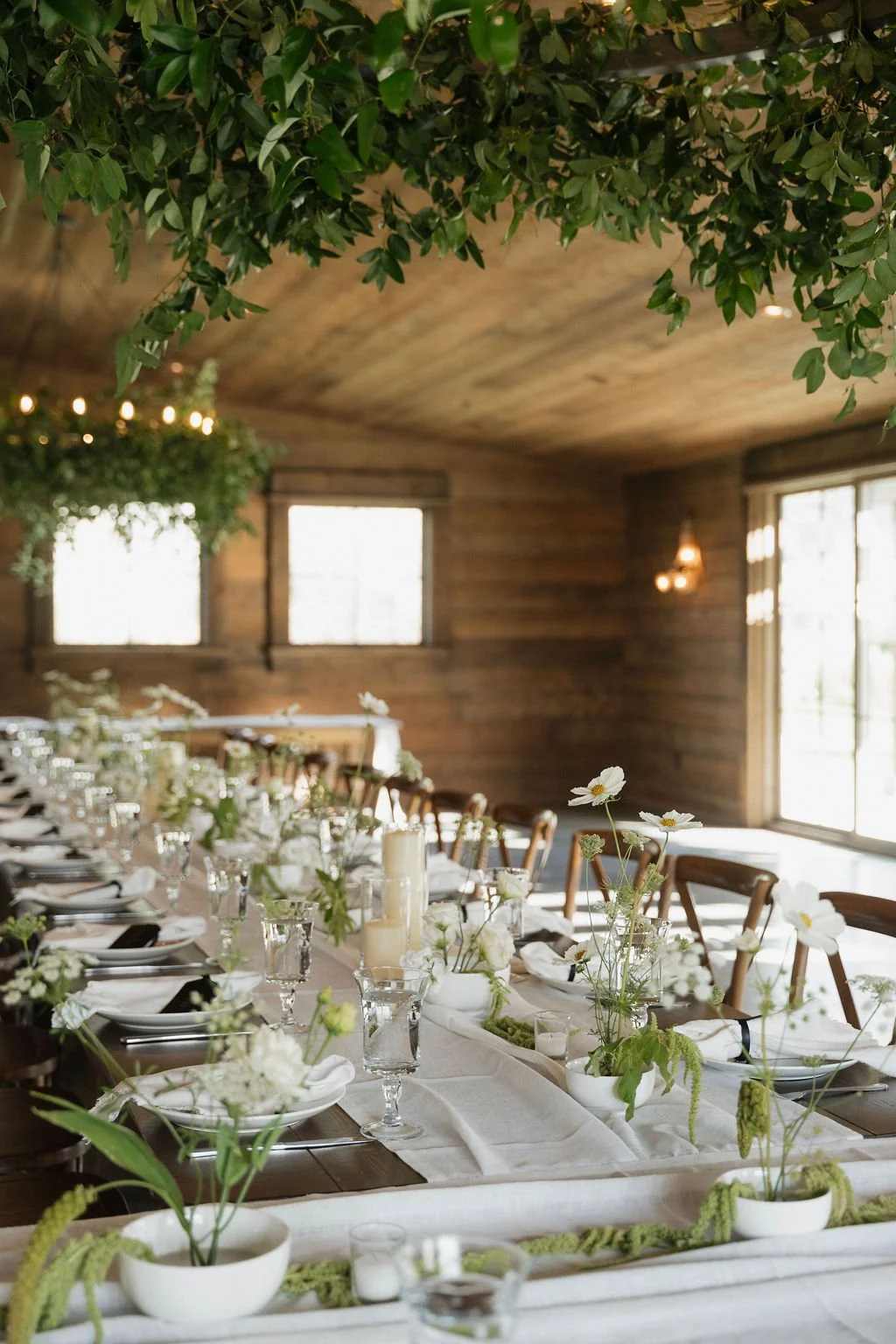 ikebana and greenery design with white linens