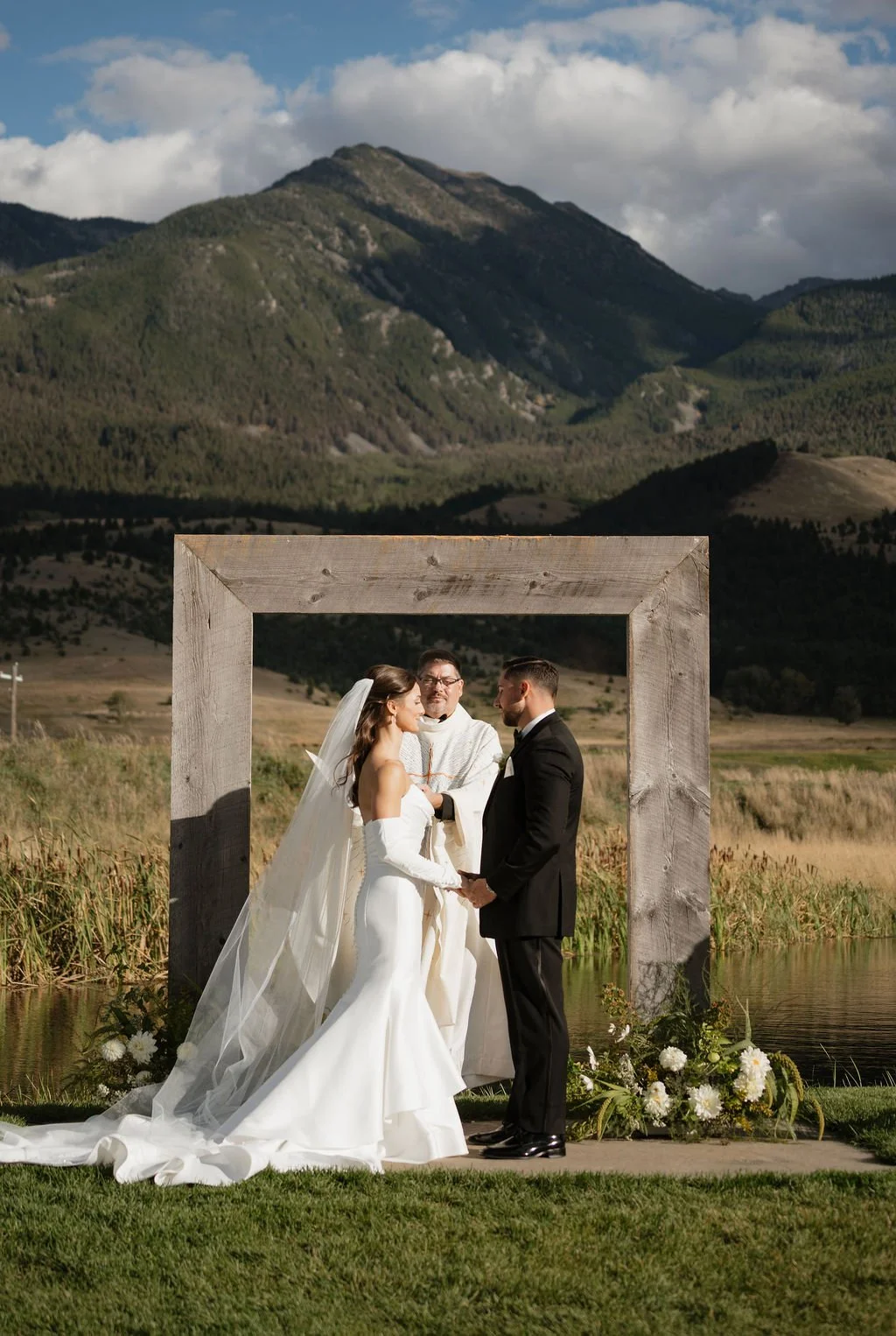 the exchange of vows at copper rose ranch with the mountains behind