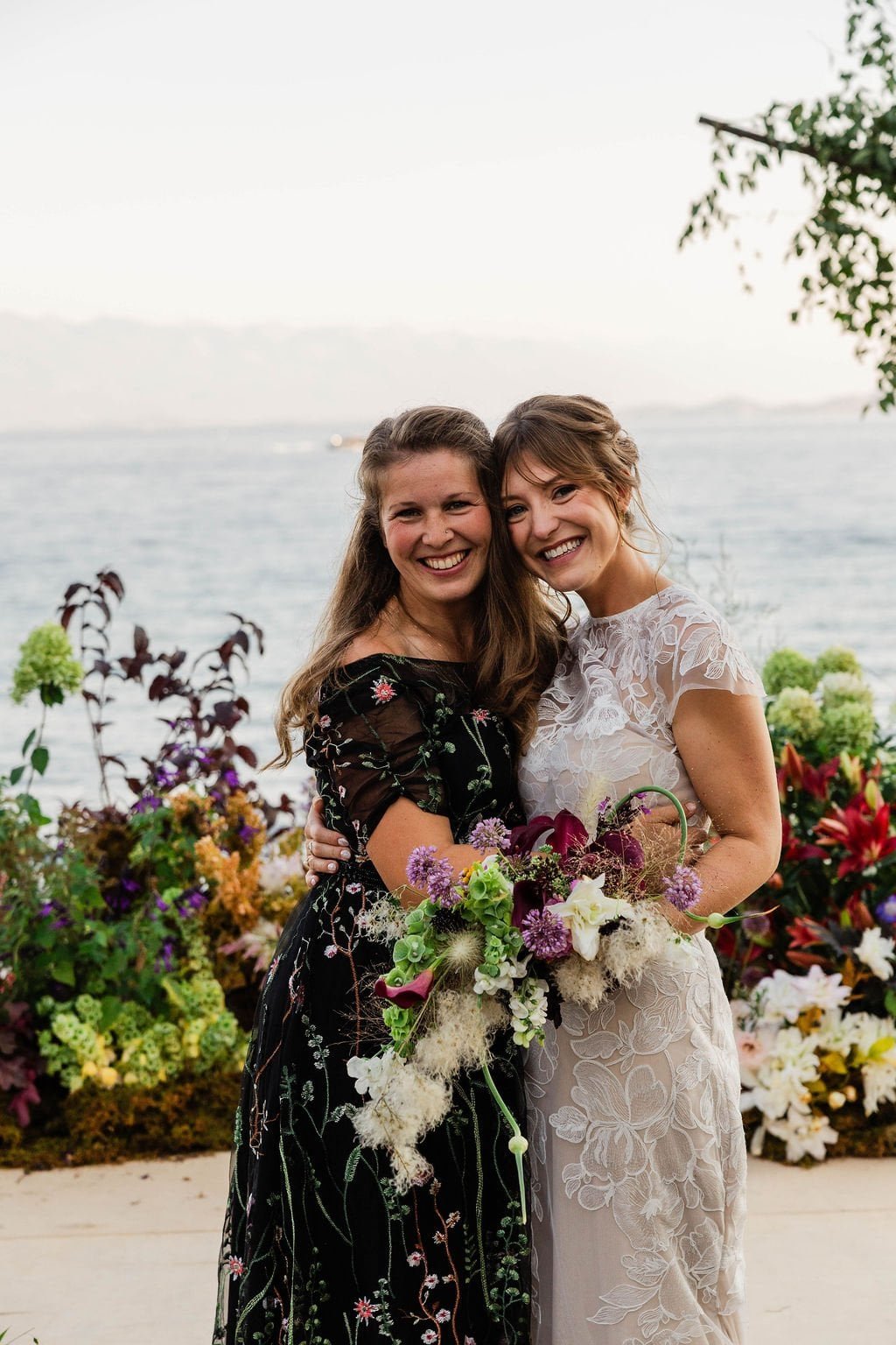 hannah a florist bozeman mt with maddy her freelancer and client in front of her wedding ceremony meadow with a cool textural bouquet