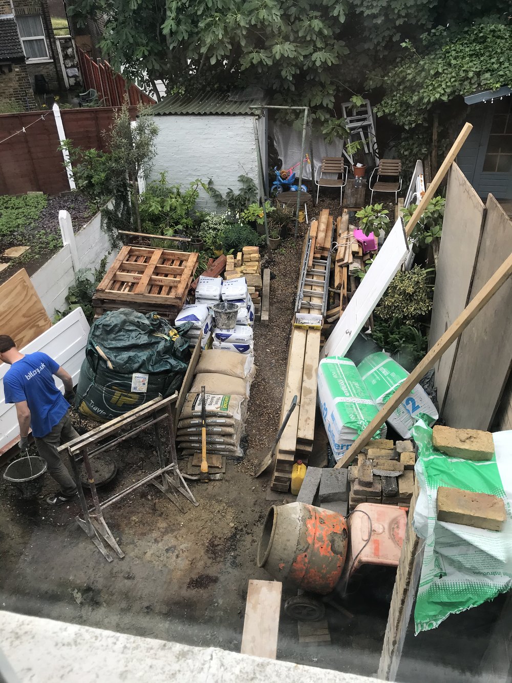 Garden being used as a building site store