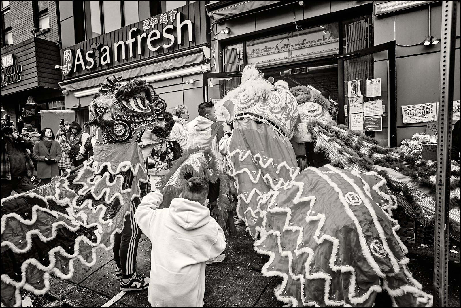 Lion Dancers Visiting Storefront