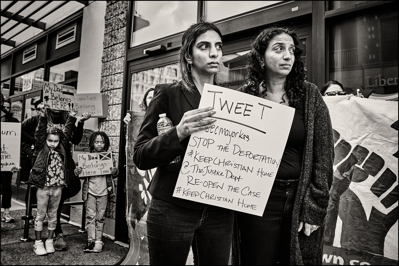  Sheila Maddali supports Sarika Kumar M’Bagoyi (right) during the rally at the ICE office in Philadelphia.  Sarika’s two daughters stand in the background. 