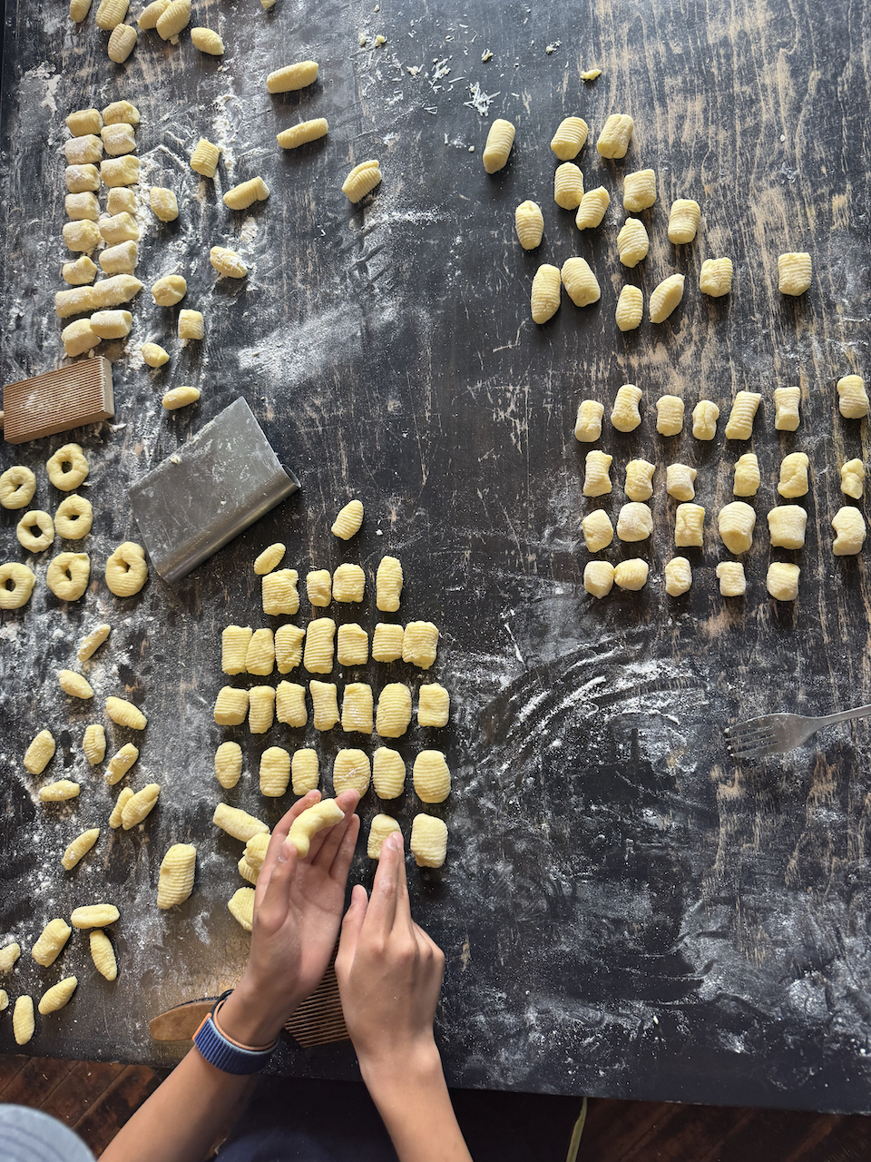 gnocchi making on table in a private cooking class at Purple Kale Kitchenworks