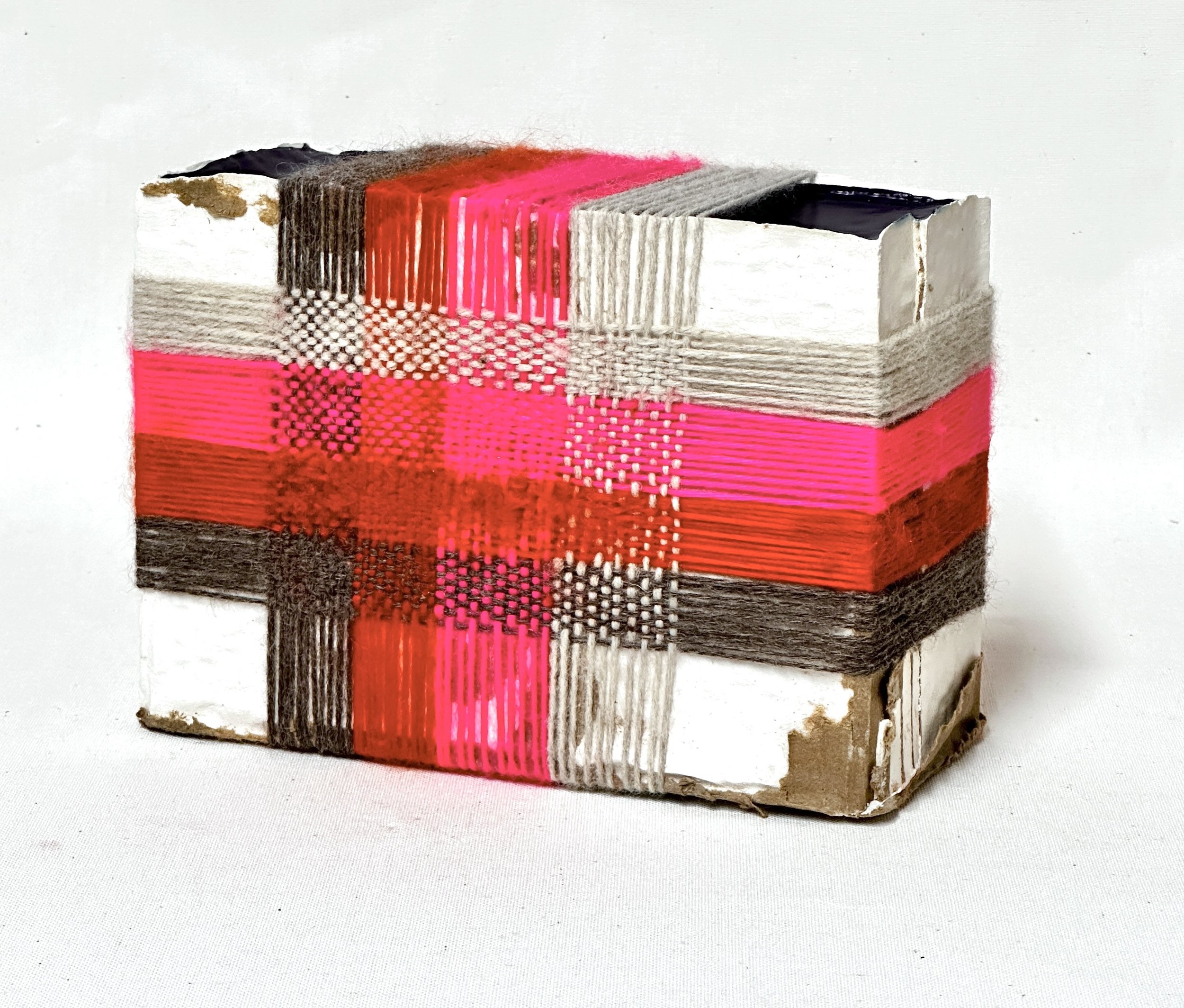 Neon Plaid.  Plaster, blue acrylic, yarn weaving, cardboard.  7"h x 10"w x 4"d.  2026