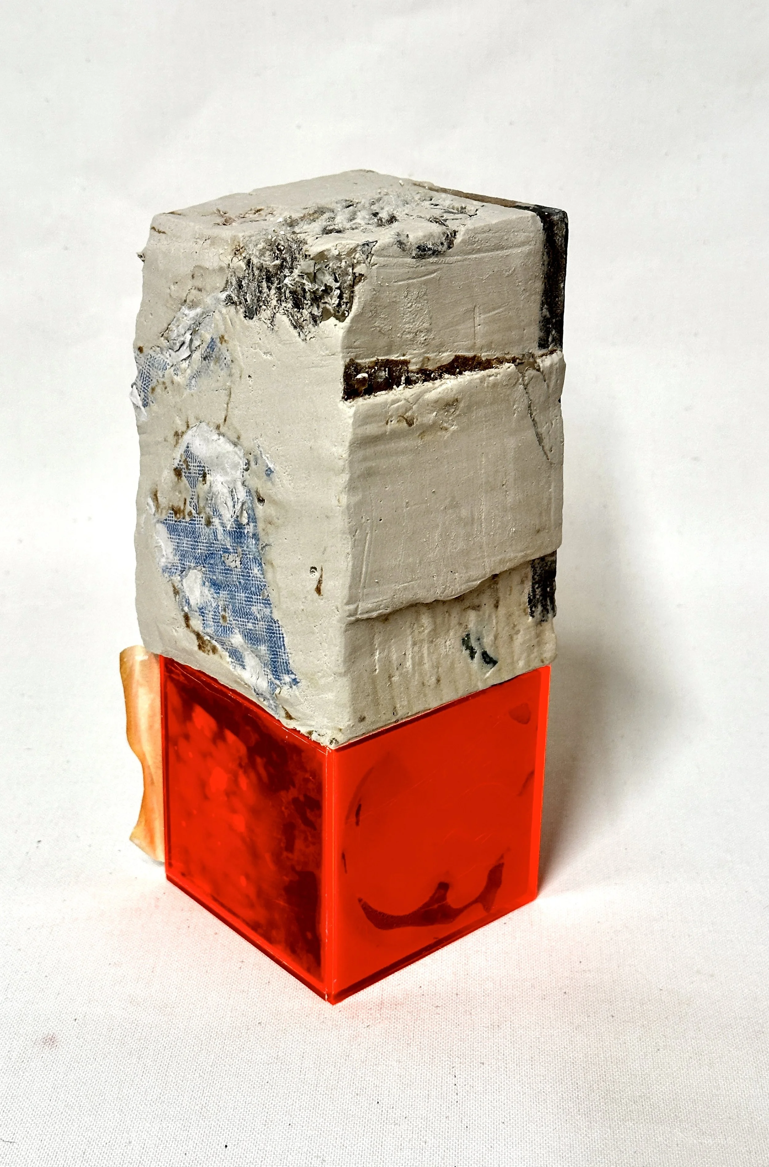 Neon Chrysanthemum. (View 3). Plaster, clay tile, yarn weaving on packing paper, neon acrylic box, polaroid, tape. 8"h x 4"w x 4"d. 2026