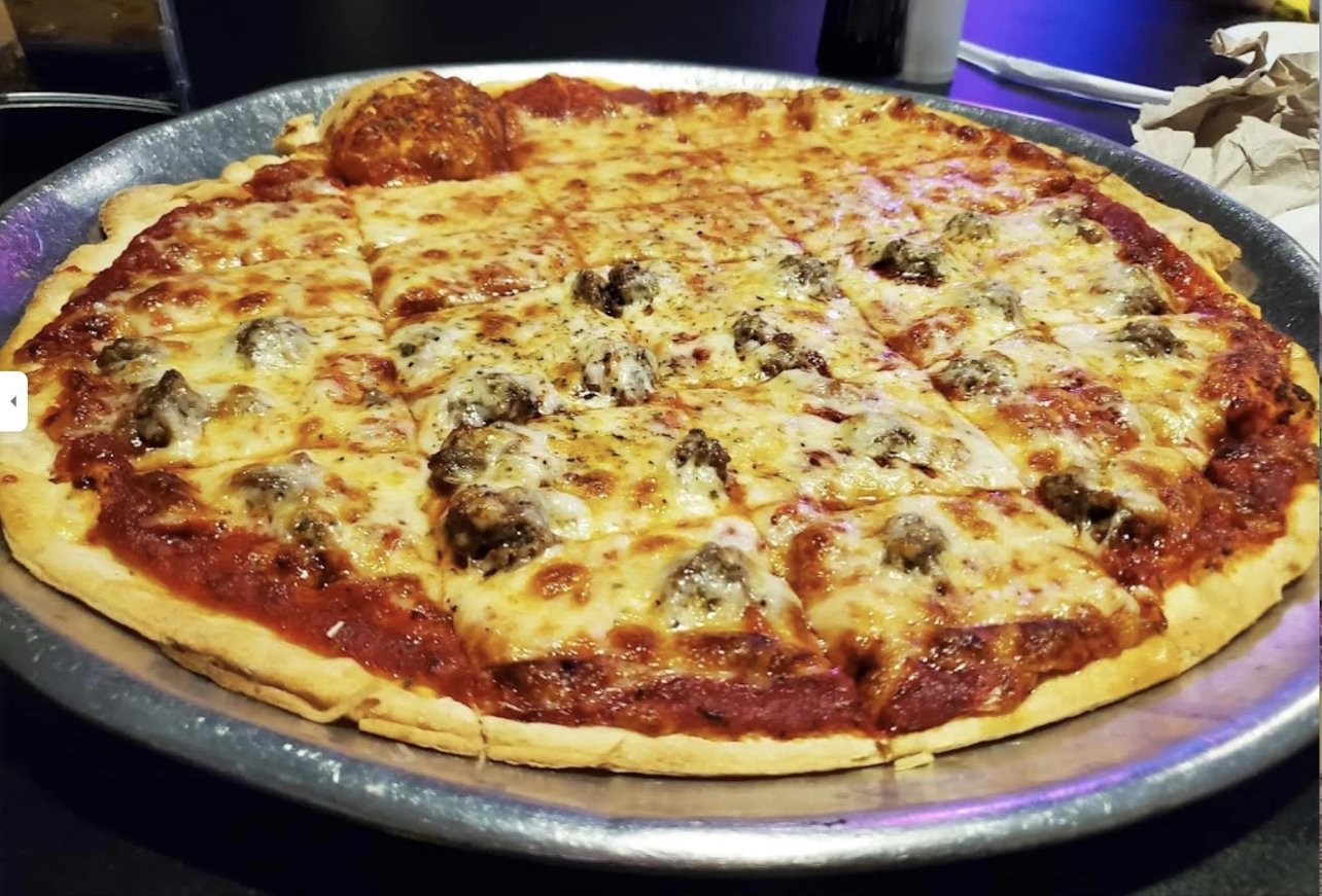 A sausage Angelo's Pizza is served at Timekeeper Distillery.