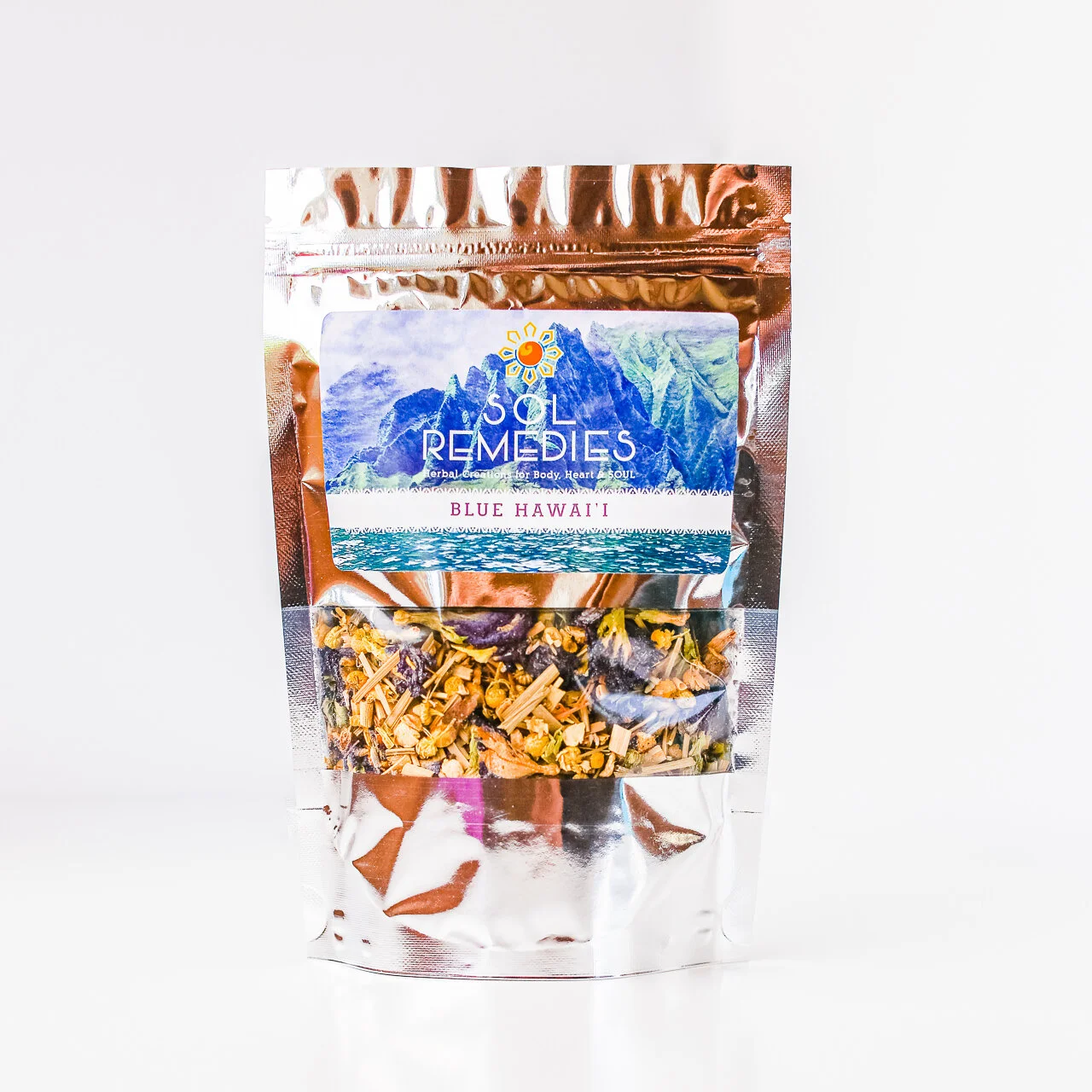 Metallic multi-colored pouch filled with tea with Sol Remedies label on front