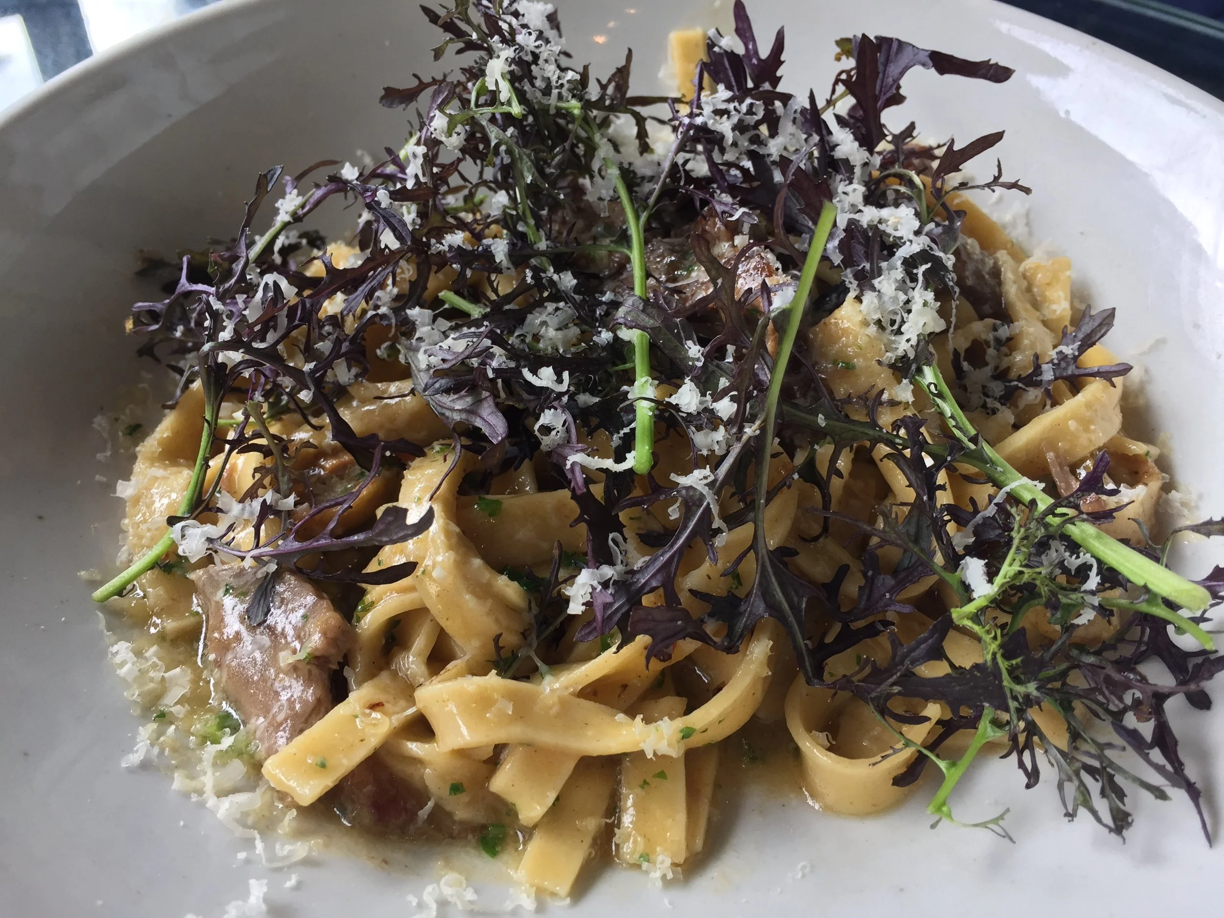 Braised lamb, tagliatelle pasta, chilli, olives, parmesan butter