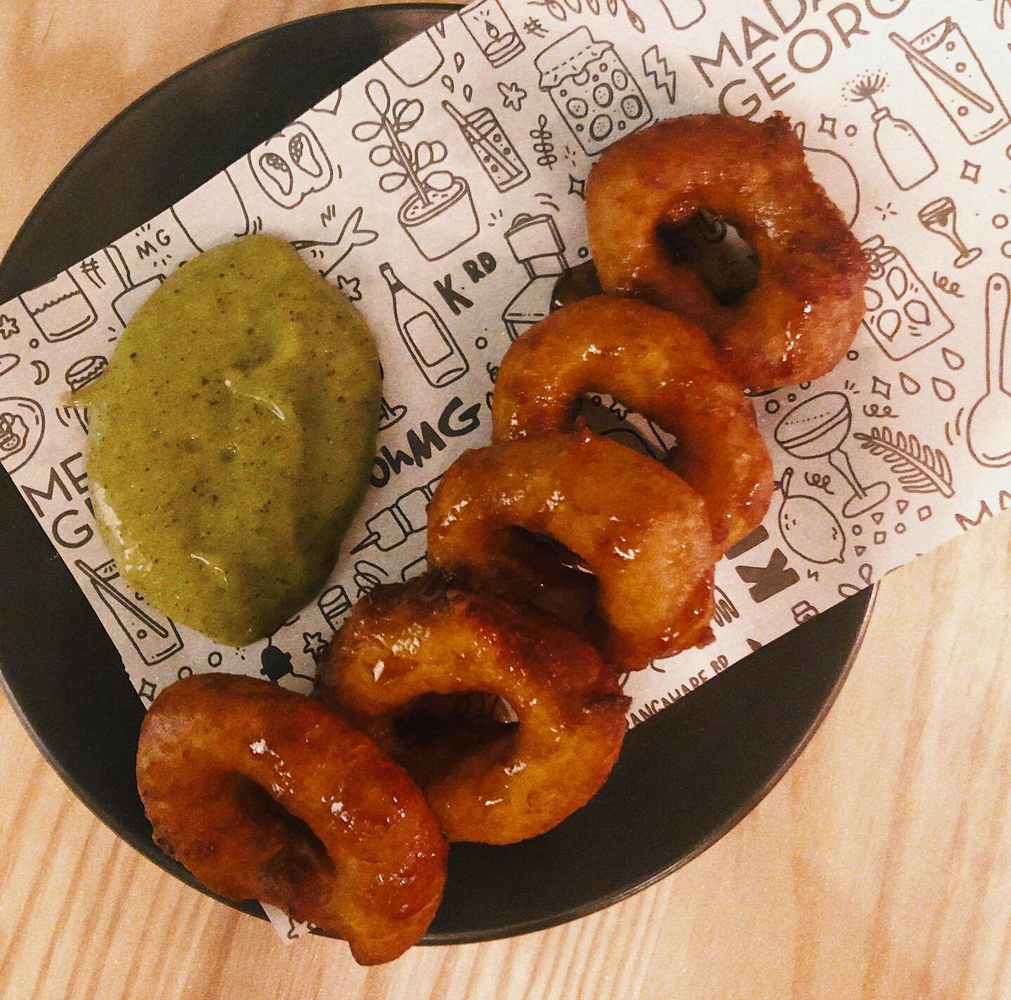 Picarones. The Peruvian fried dough sensation you didn&rsquo;t know you needed until now. Pumpkin doughnuts that are light and almost a little savoury, drizzled in a molassesy caramel and served with a tangy kiwifruit sauce. Find them at @madamegeorgenz 

#eatitauckland #madamegeorge #picarones #doughnuts #peruvian #krd #karangahaperoad #lovekrd #aucklandfood#aucklandfoodie #aucklandbar