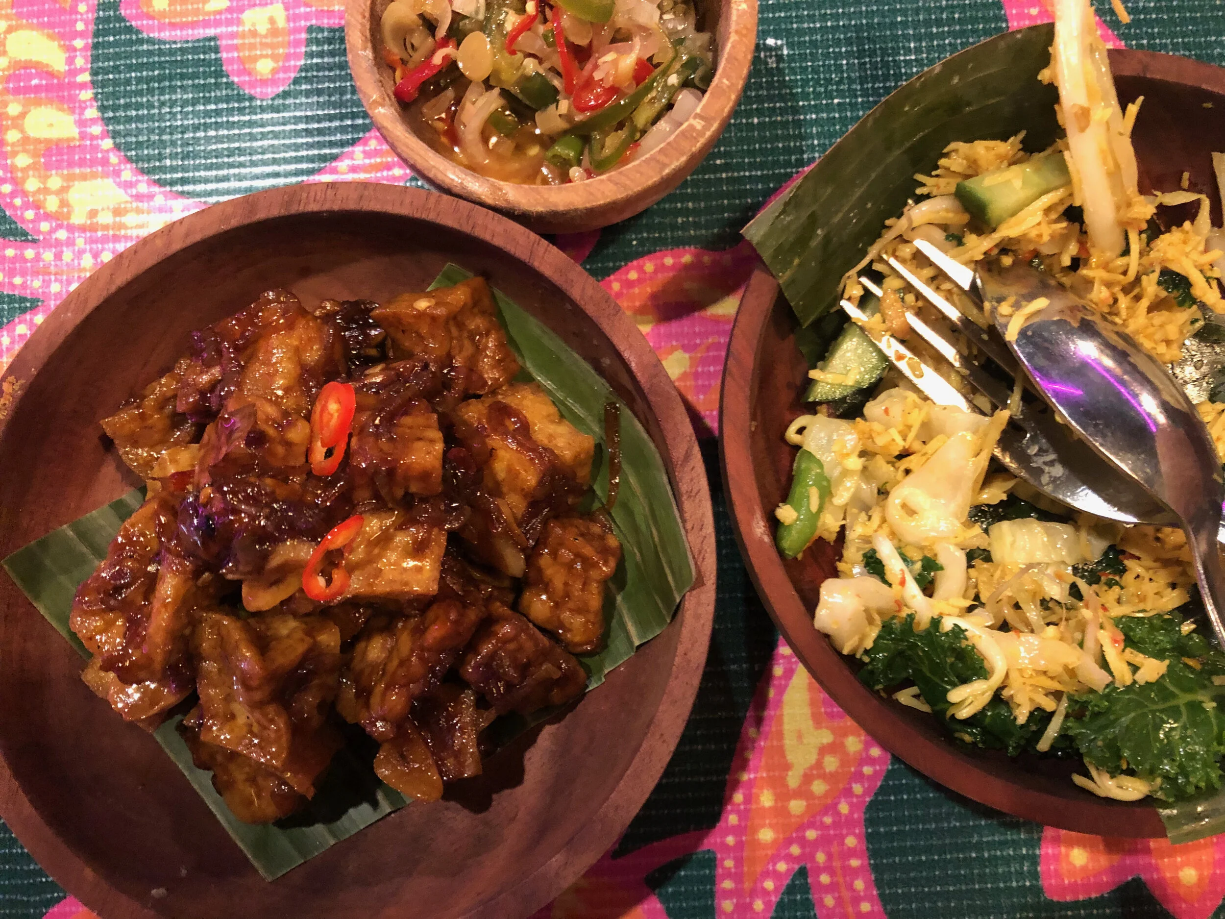 Orek tempe (left), sambal matah (top), sayur urap  (right)