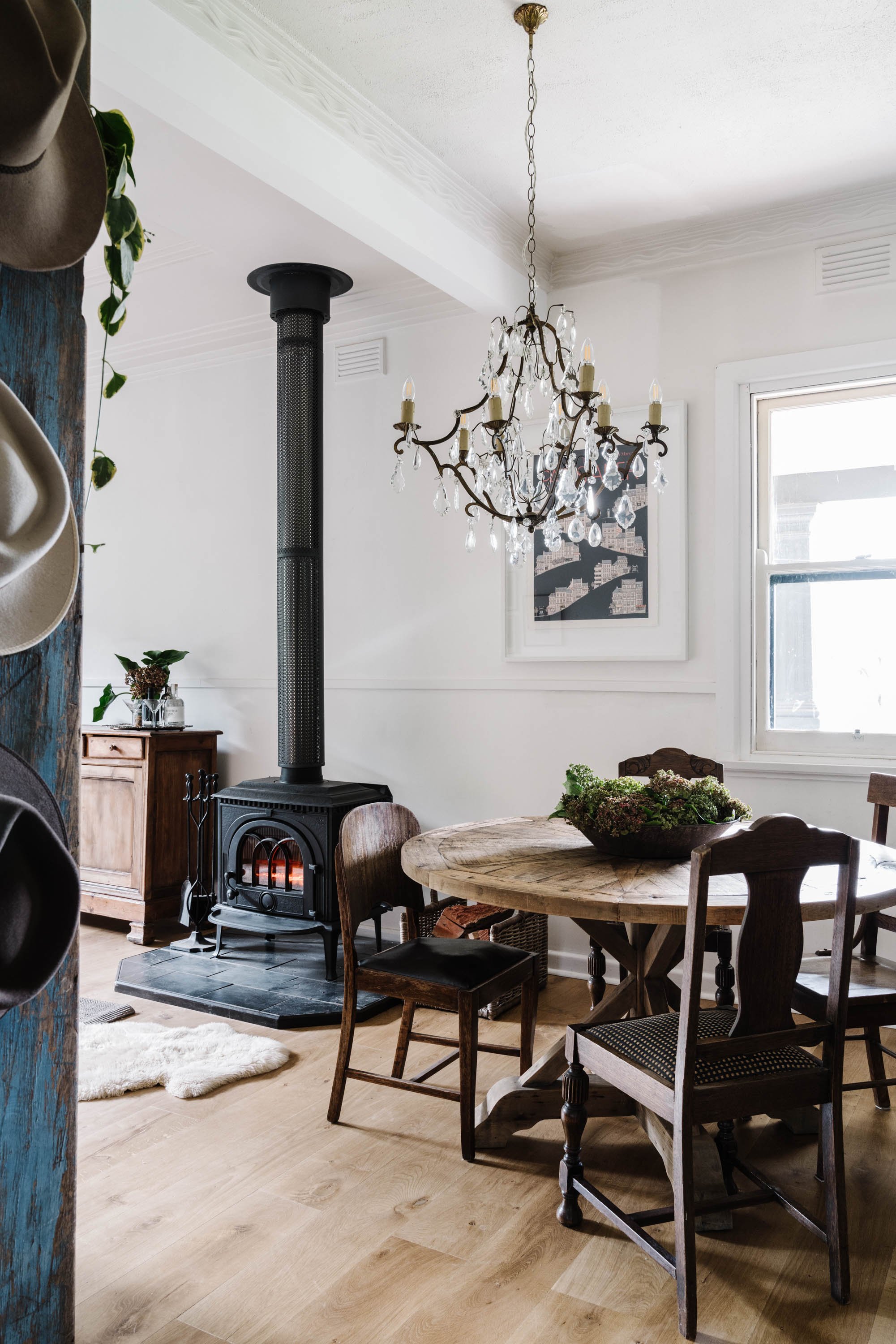 Editorial interior image of the dining room inside the restored cottage at Dunmore Farm