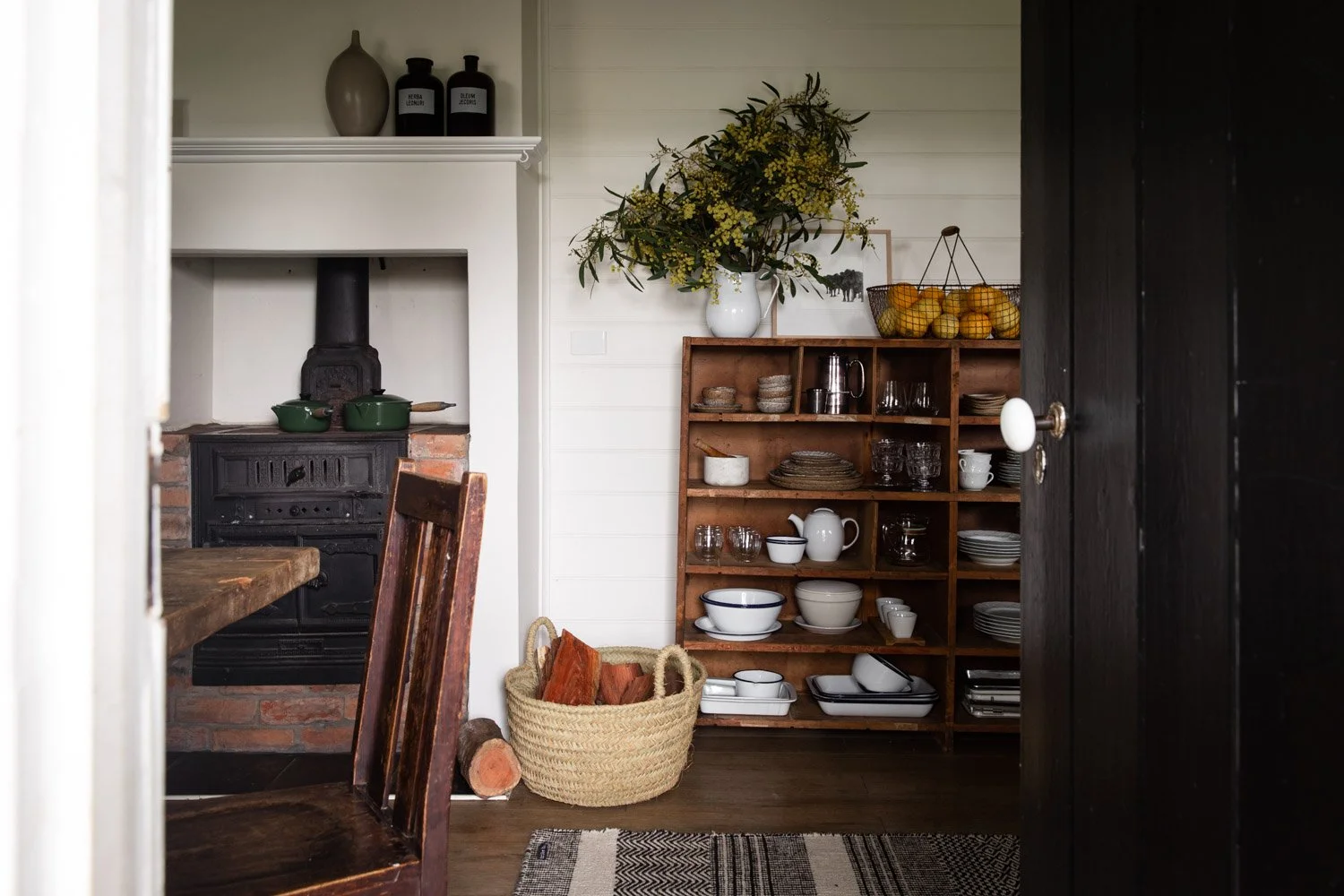 View into the cottage kitchen and fireplace at Dunmore Farm in North East Victoria