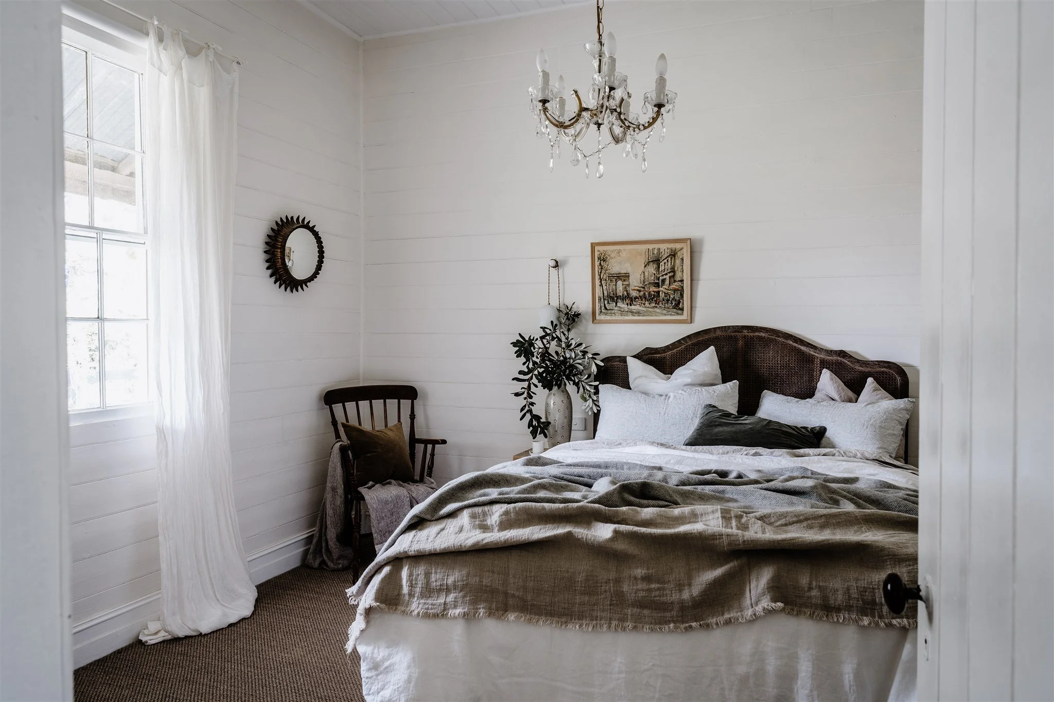 Light-filled bedroom inside the restored heritage cottage at Dunmore Farm