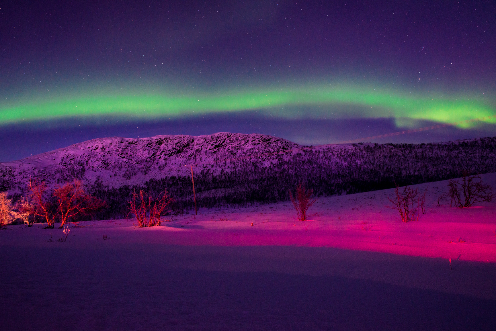 Northern lights casting on mountain.JPG