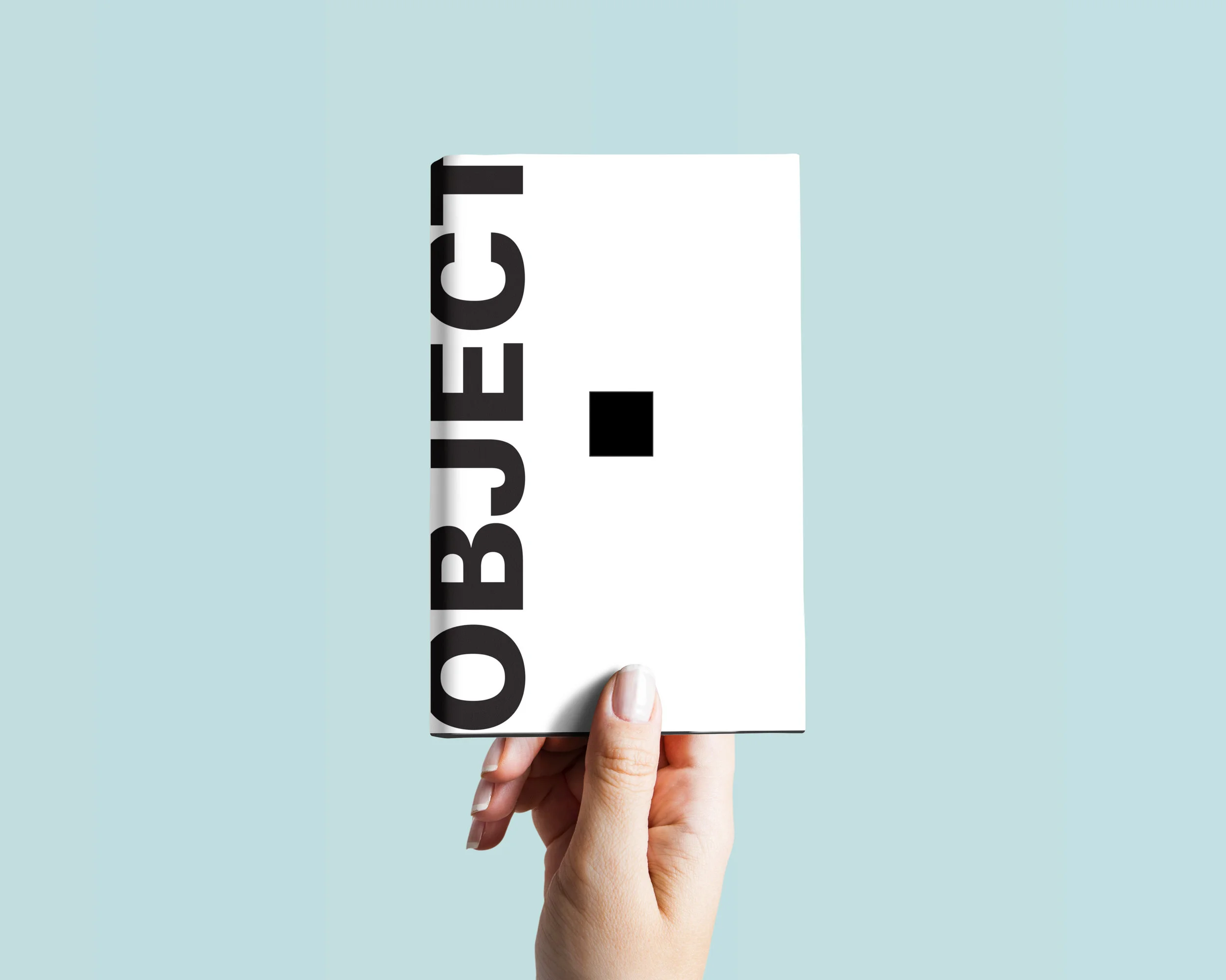 Hardcover-Book-In-Hand-Mockup.jpg