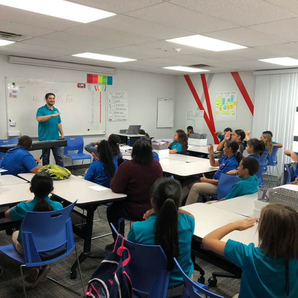 Mr. Medina harmonizing during music class at Nevada Rise Academy