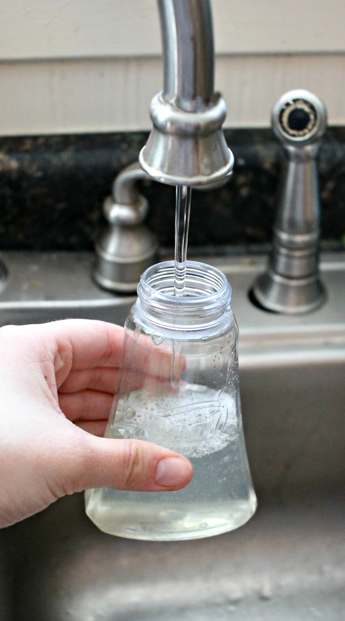 filling bottle with water