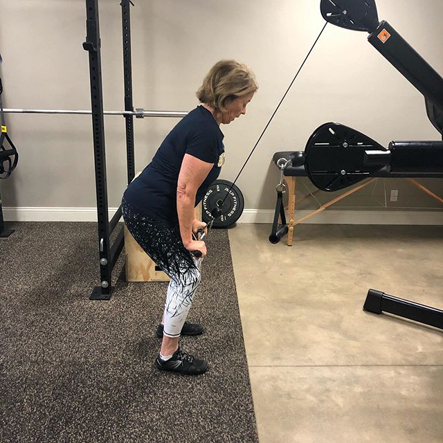 This little lady is executing upper body exercise, &ldquo;straight arm lat pull down.&rdquo;