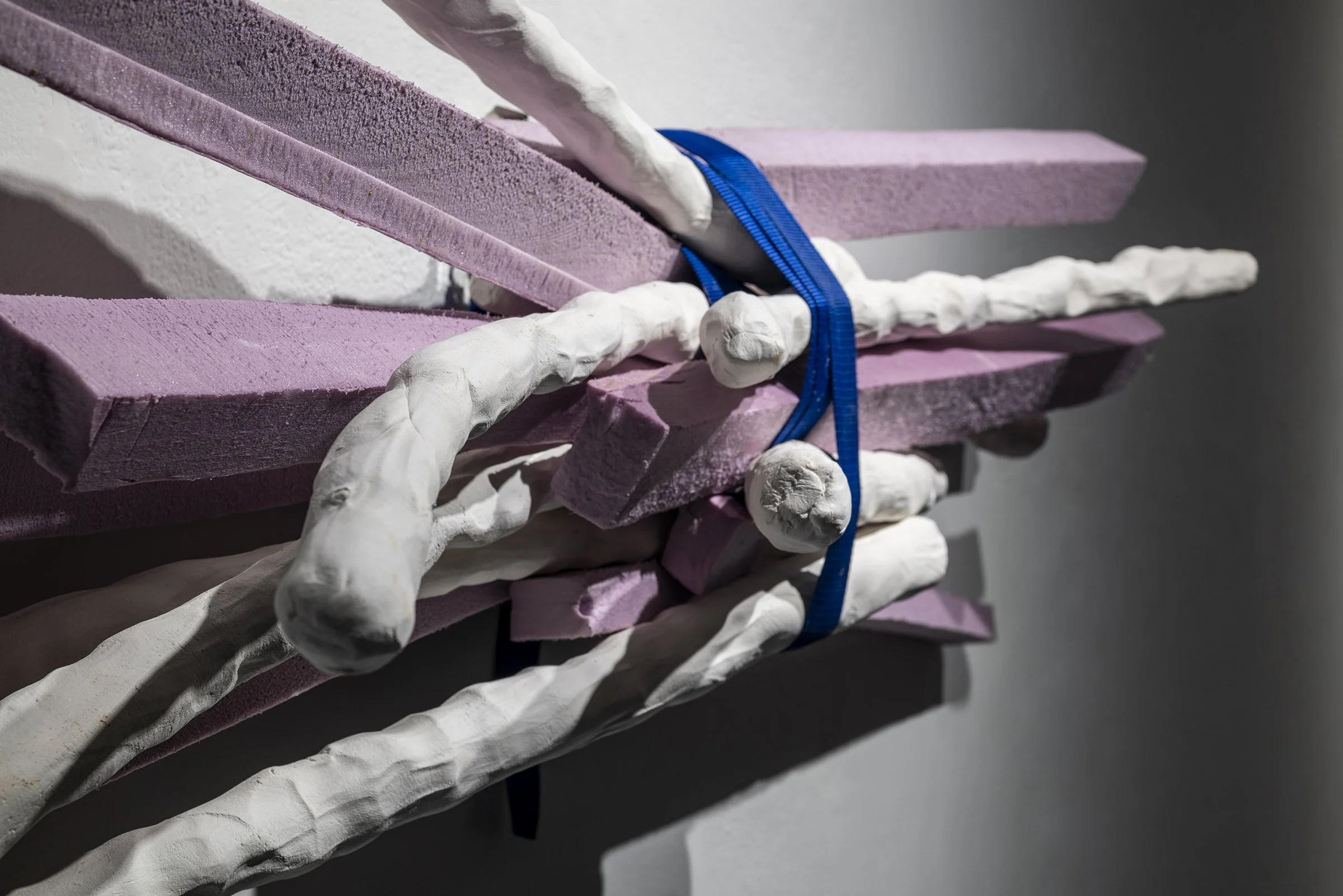      AWRY-DETAIL OF THE DRIFTING BLUE STRAPPED LENTICULAR CLOUD&nbsp;    &nbsp;&nbsp;&nbsp;Porcelain, lavender insulation foam, ratchet strap, light &amp; shadow. 14” x 40” x 12”, 2021     