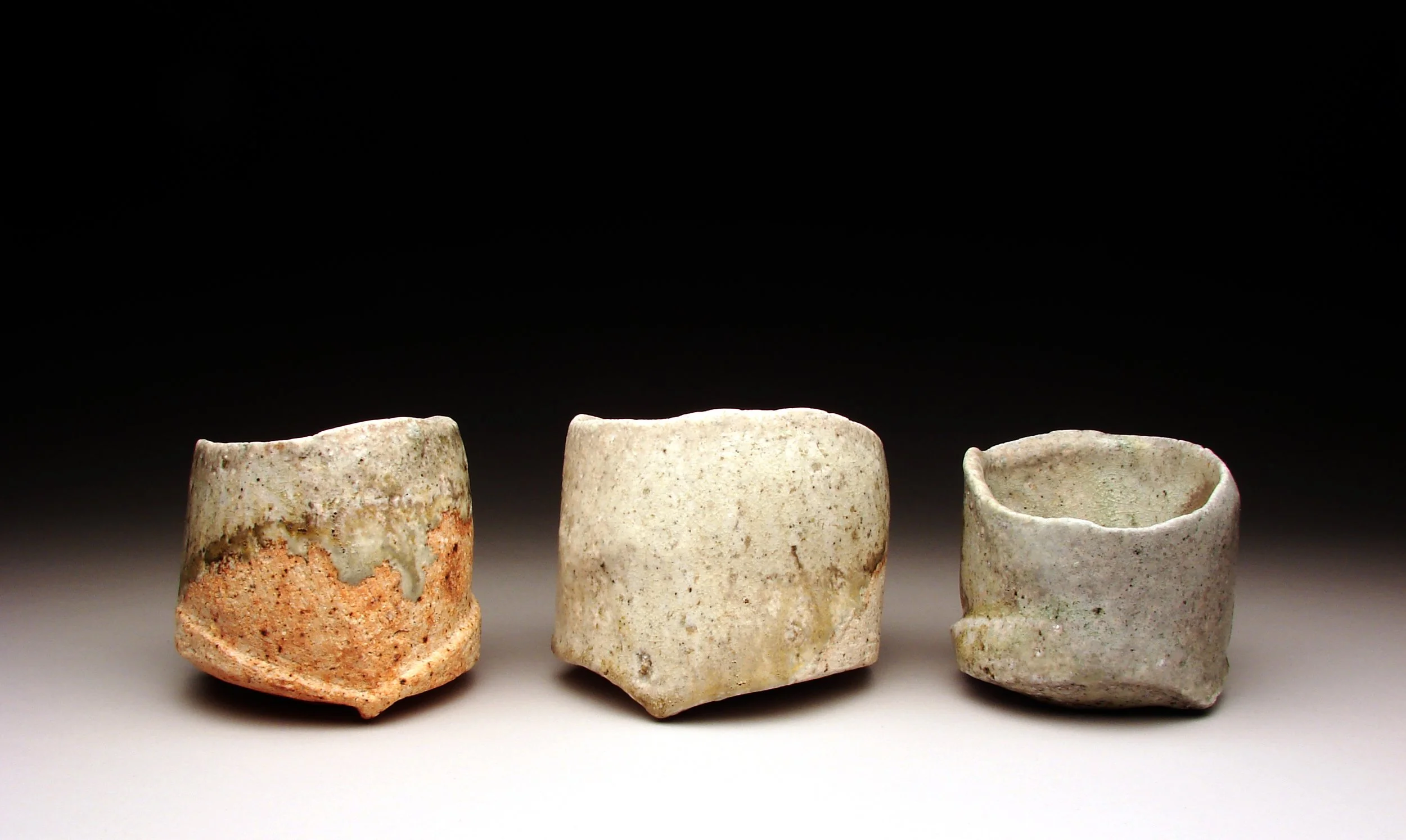     BFA,  B. Cirgin —  Shaped Bowls&nbsp;    Anagama fired ceramic. 5" x 20" x 5", 2012     