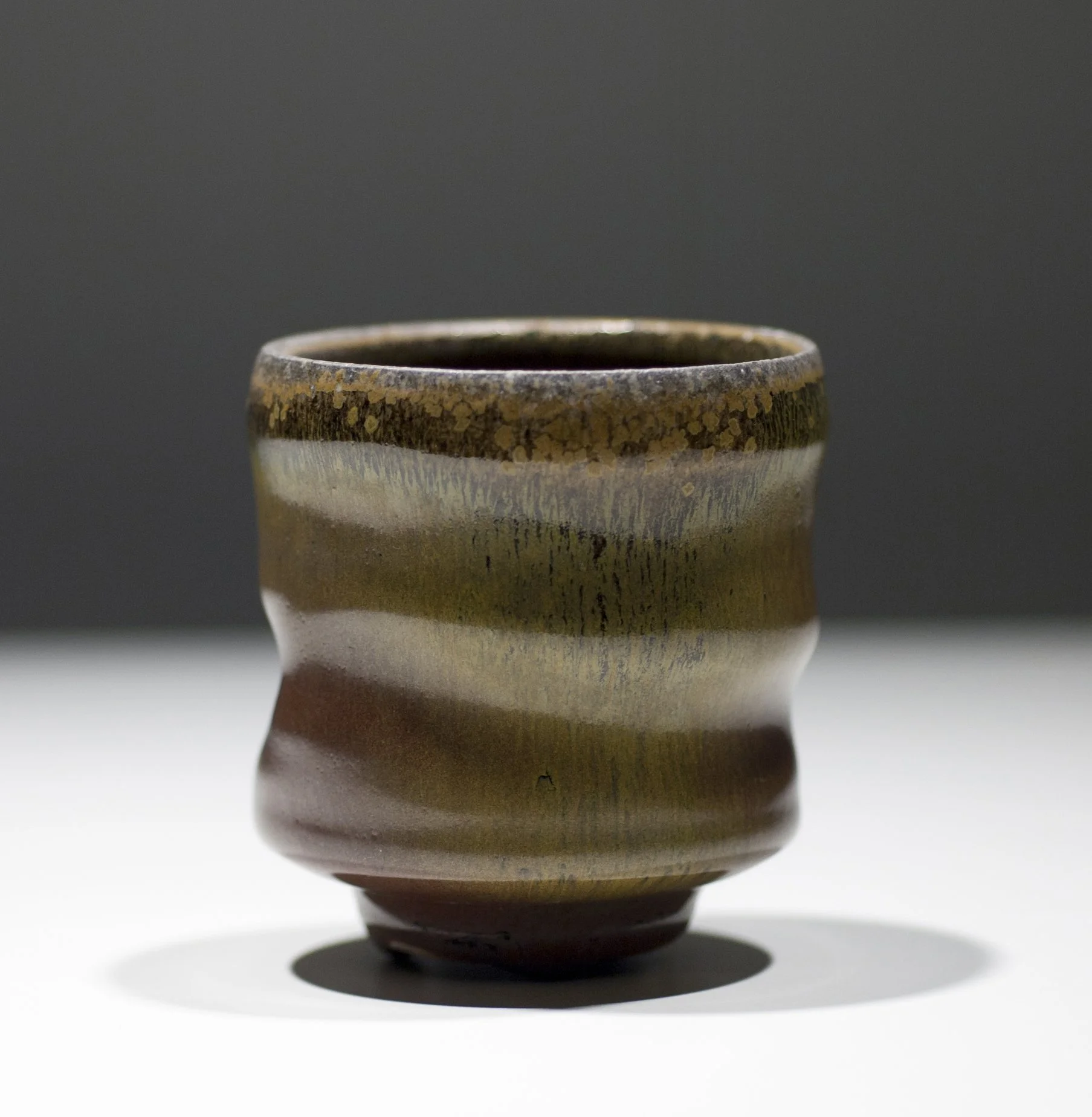     BFA,  C. Smart ‍  —  Brown / Green Cup&nbsp;       Soda-fired ceramic. 3.5" x 3" x 3", 2012&nbsp;     