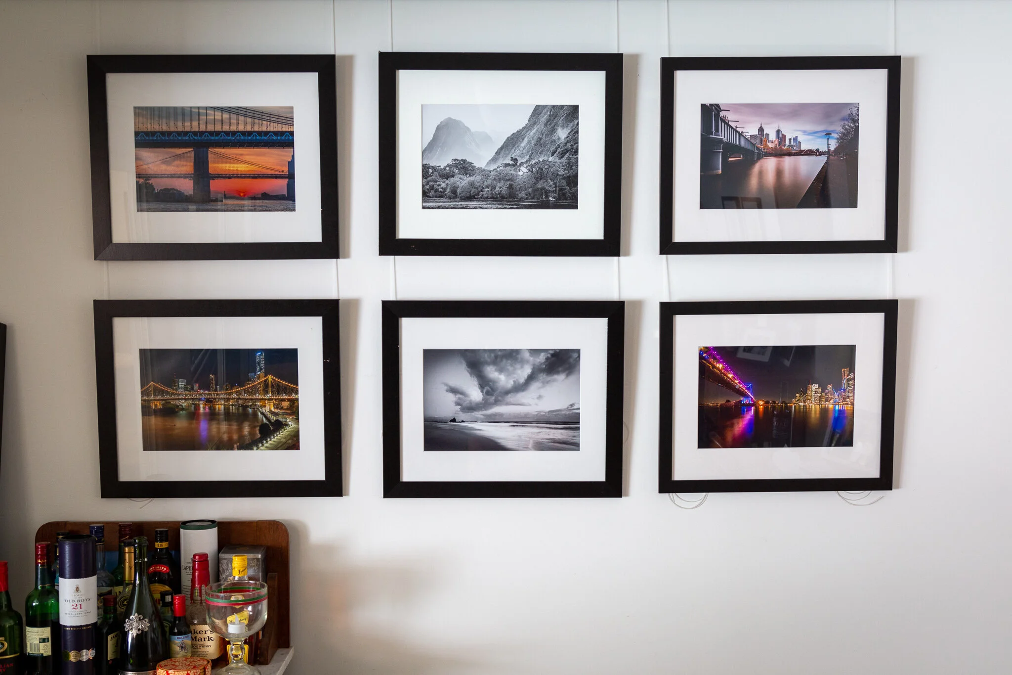 Gorgeous home gallery by Tony FitzGerald. This is a gallery-style set up where the images are hung from a sliding mechanism above and just out of shot. A similar system is used in many galleries, including Percolator Gallery where we will host Collections 2020. Beverage, anyone?
